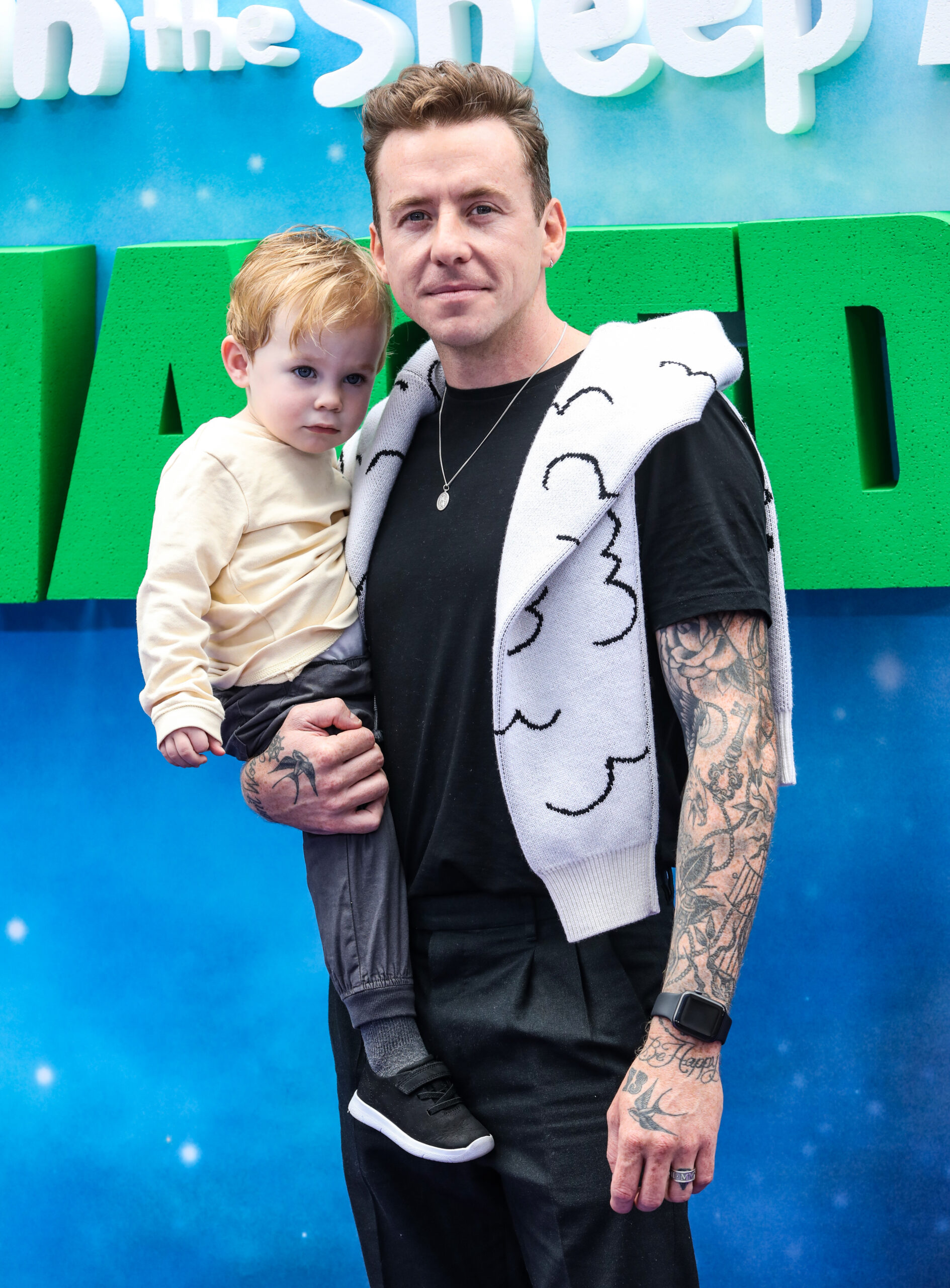 Danny Jones holding son Cooper 