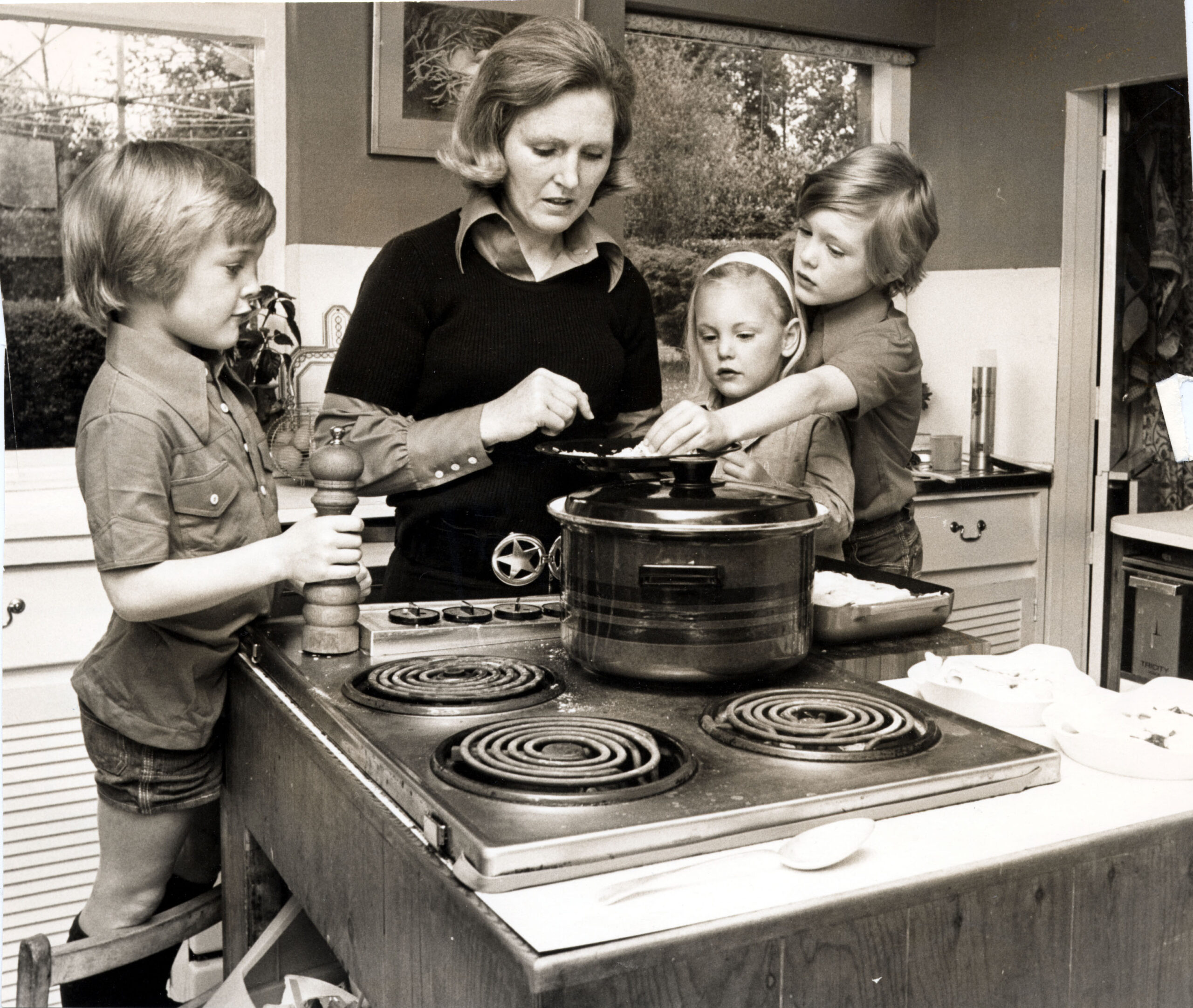 Black and white picture of a young Mary Berry with her children