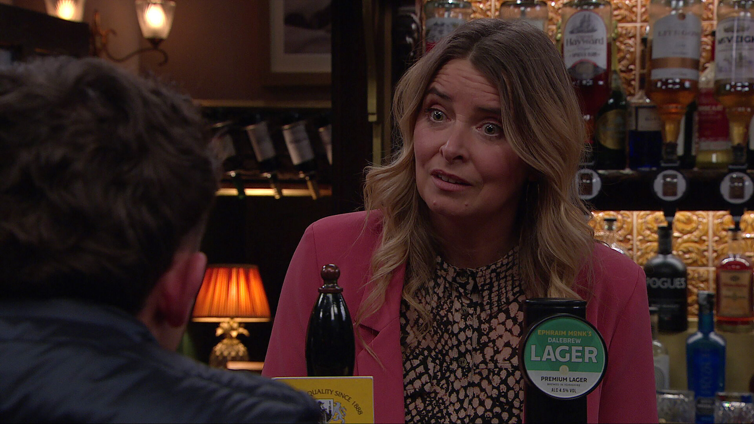 Charity talking to Jacob in the pub in Emmerdale