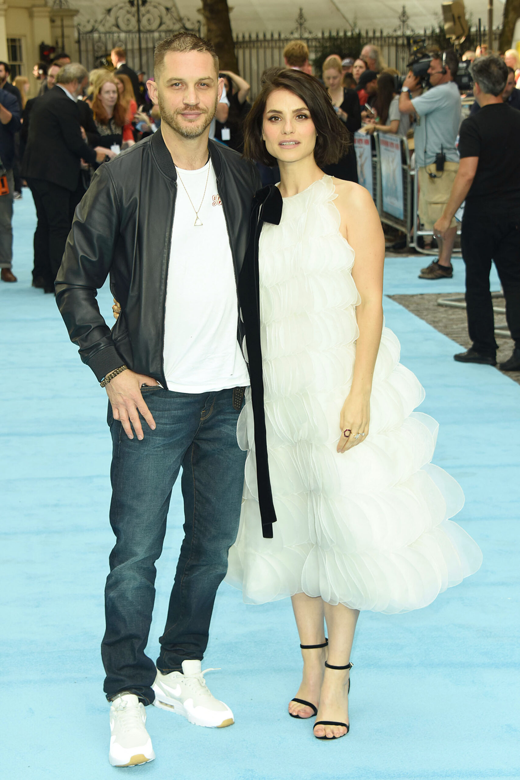 Tom Hardy and wife Charlotte posing