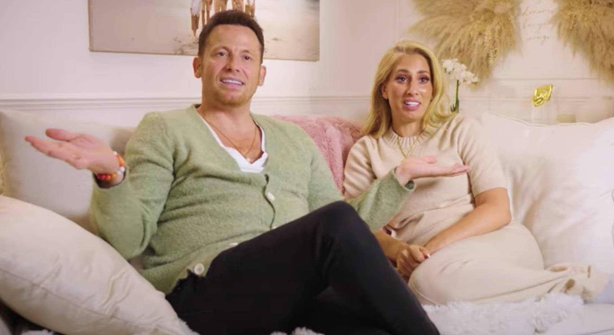 Joe Swash and Stacey Solomon sit together