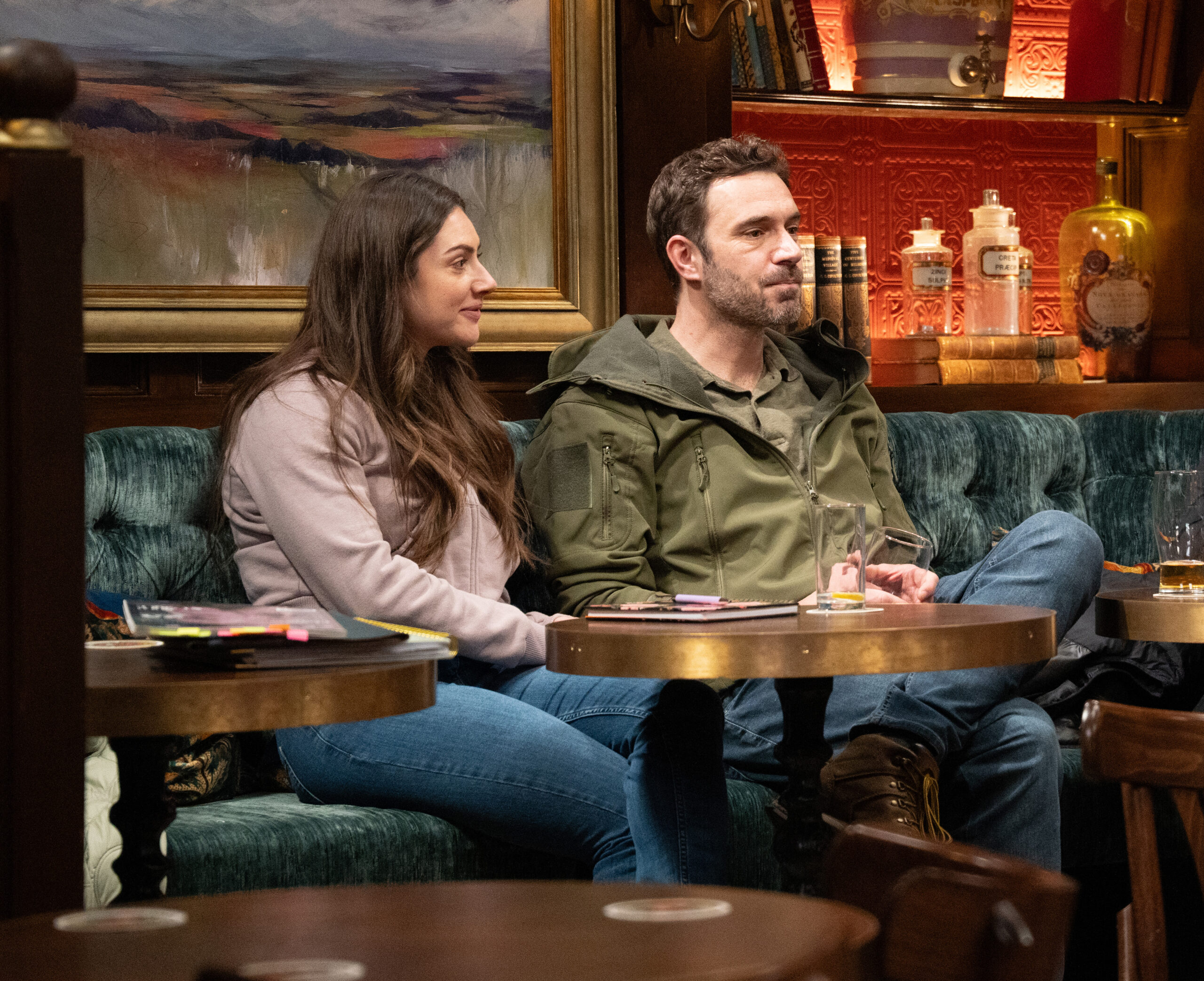 Victoria and John talking in the pub