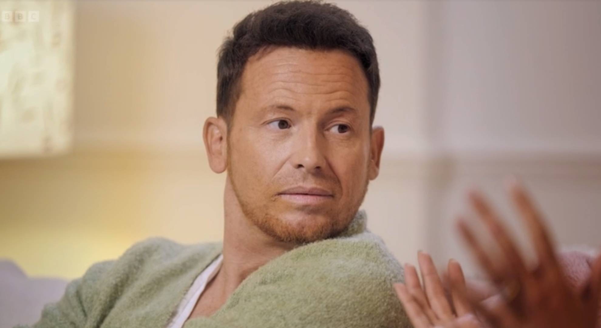 Joe Swash looks back over his shoulder