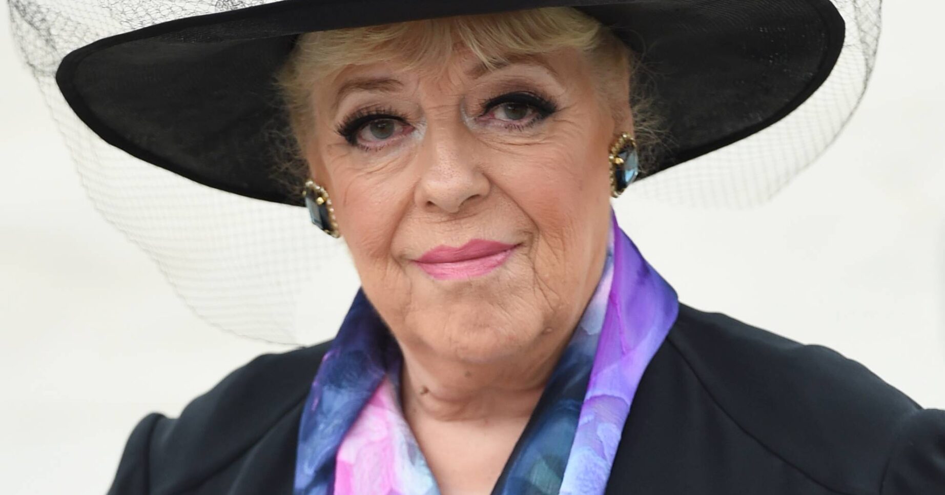 Julie Goodyear smiles faintly