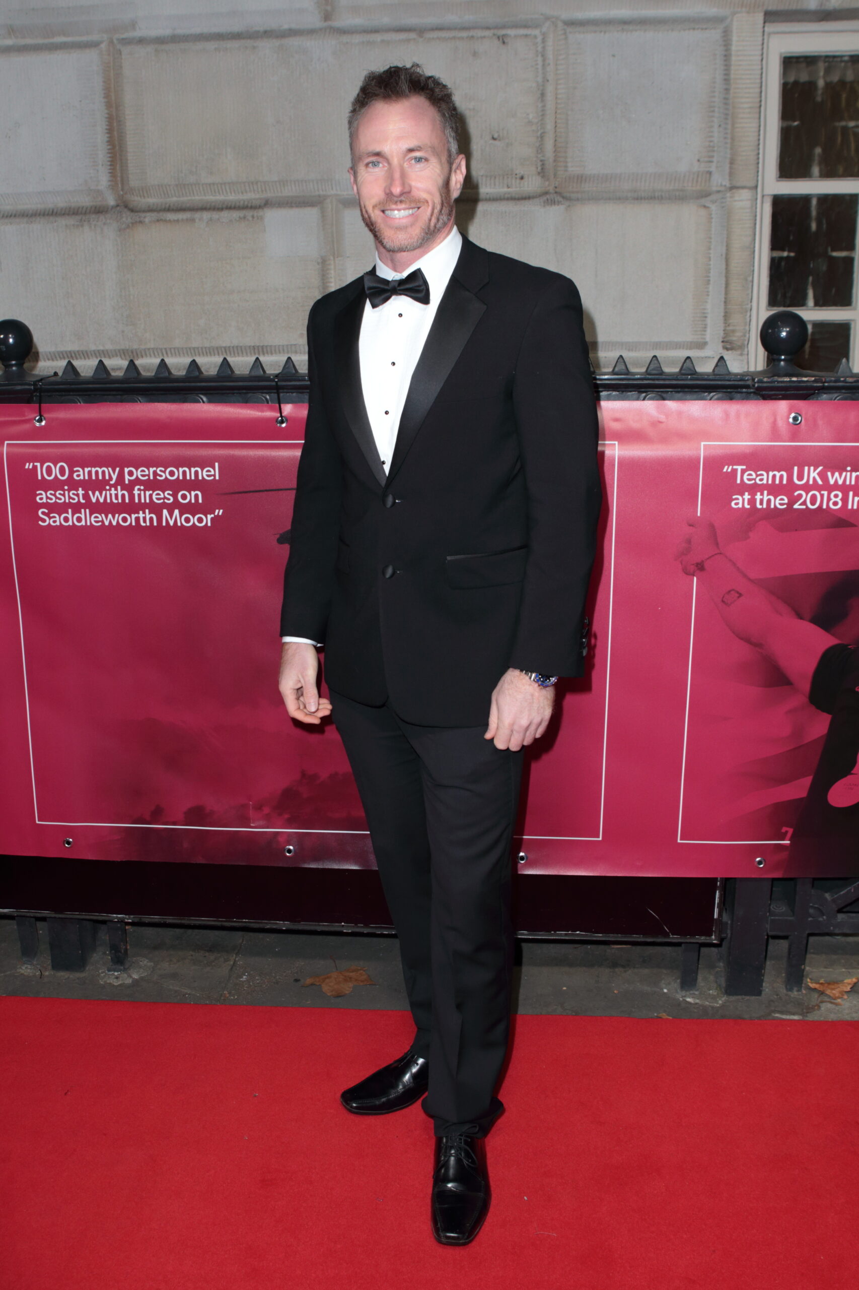 James Jordan smiling on the red carpet