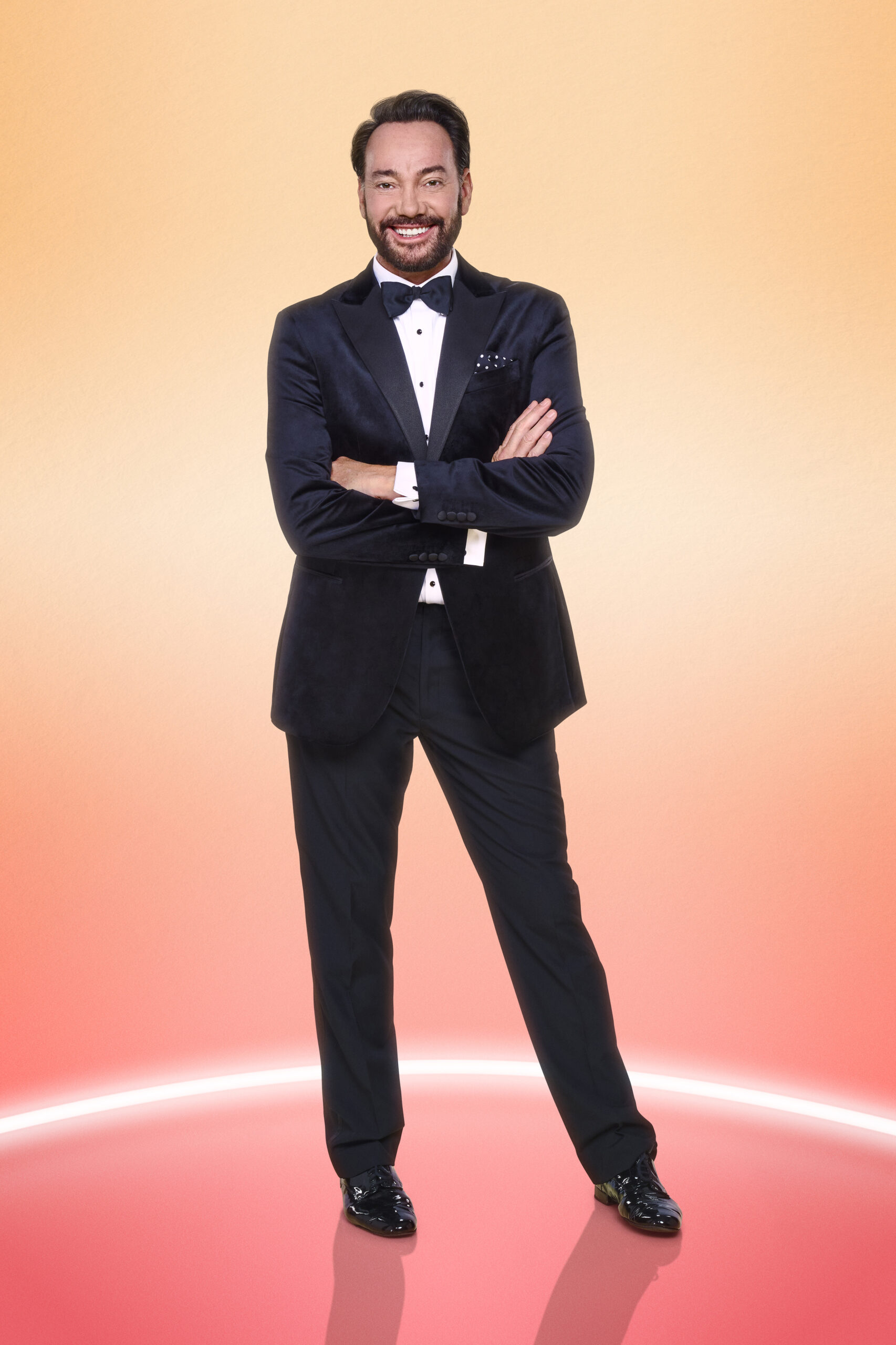 Craig Revel Horwood posing in Strictly promo picture 