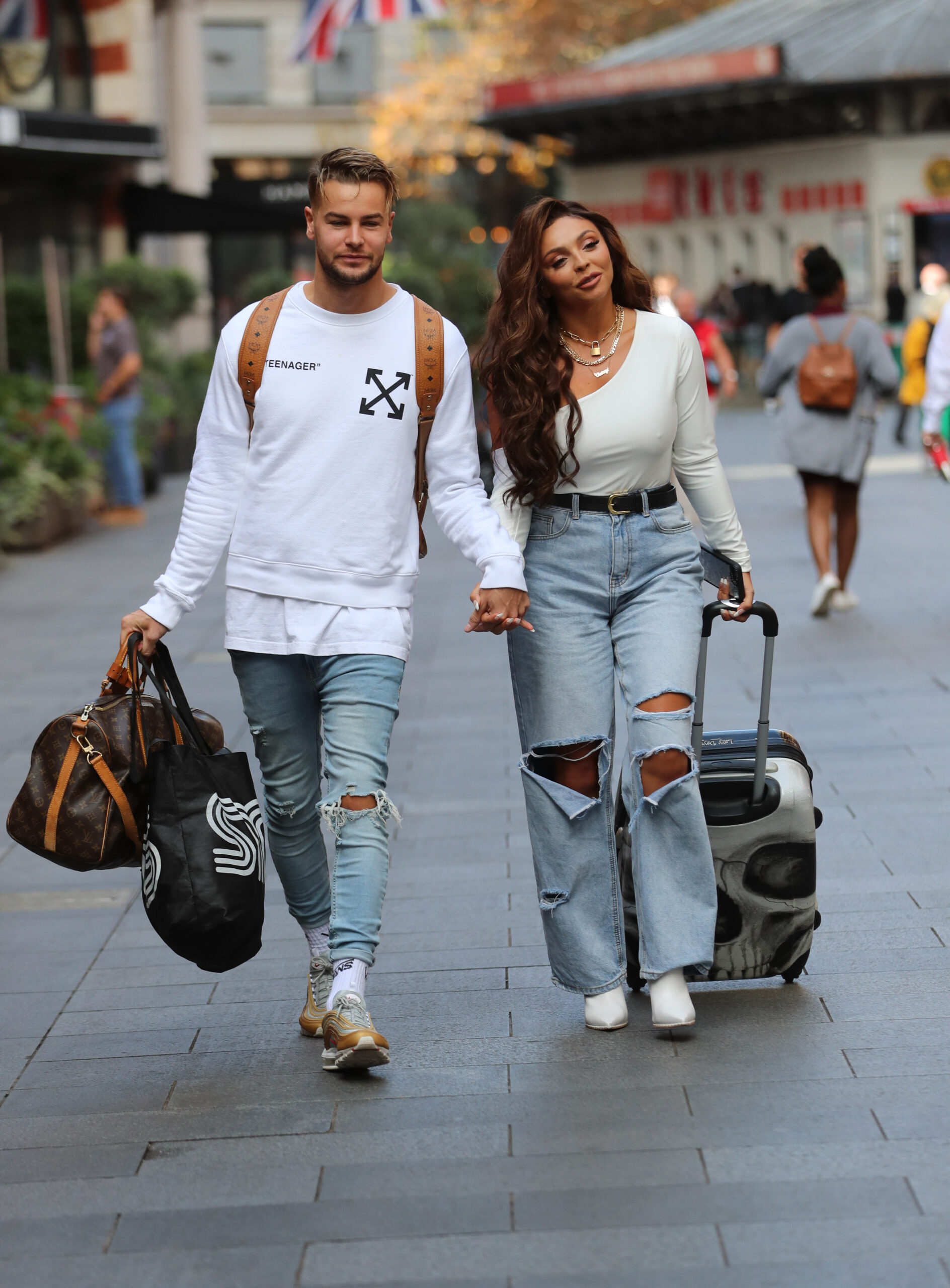Chris Hughes hand in hand with Jesy Nelson 