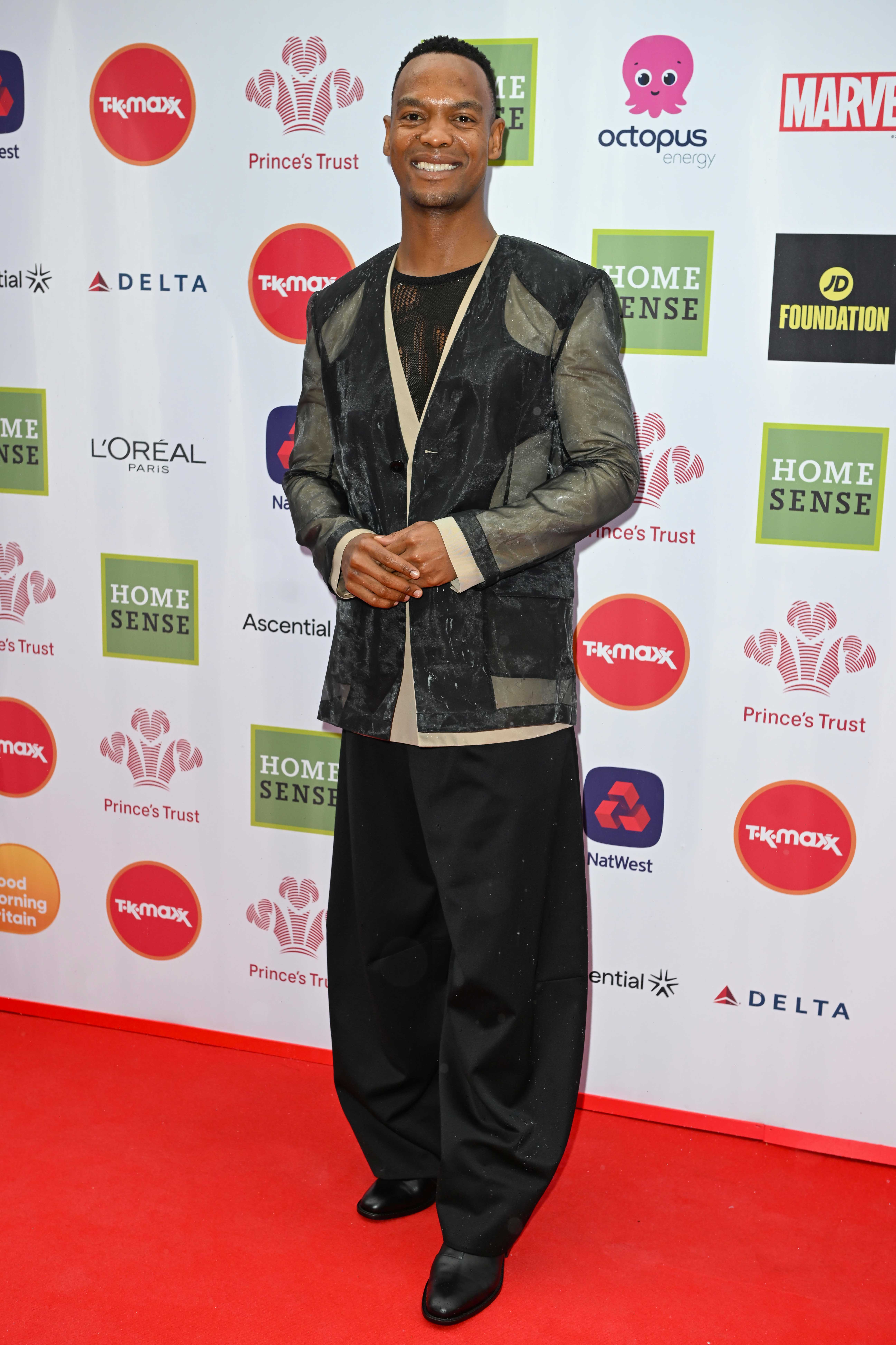 Johannes Radebe on the red carpet