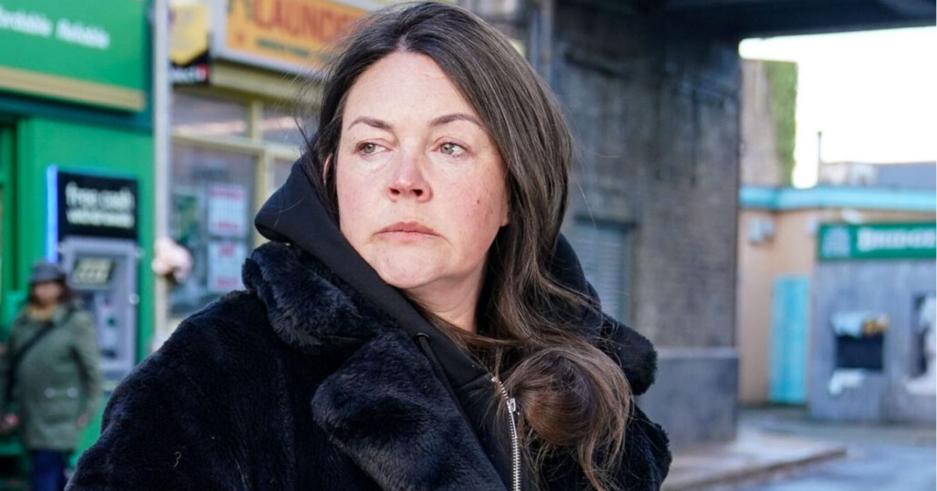 Stacey looks troubled as she stands outside on EastEnders (Credit: BBC/Composite: ED!)