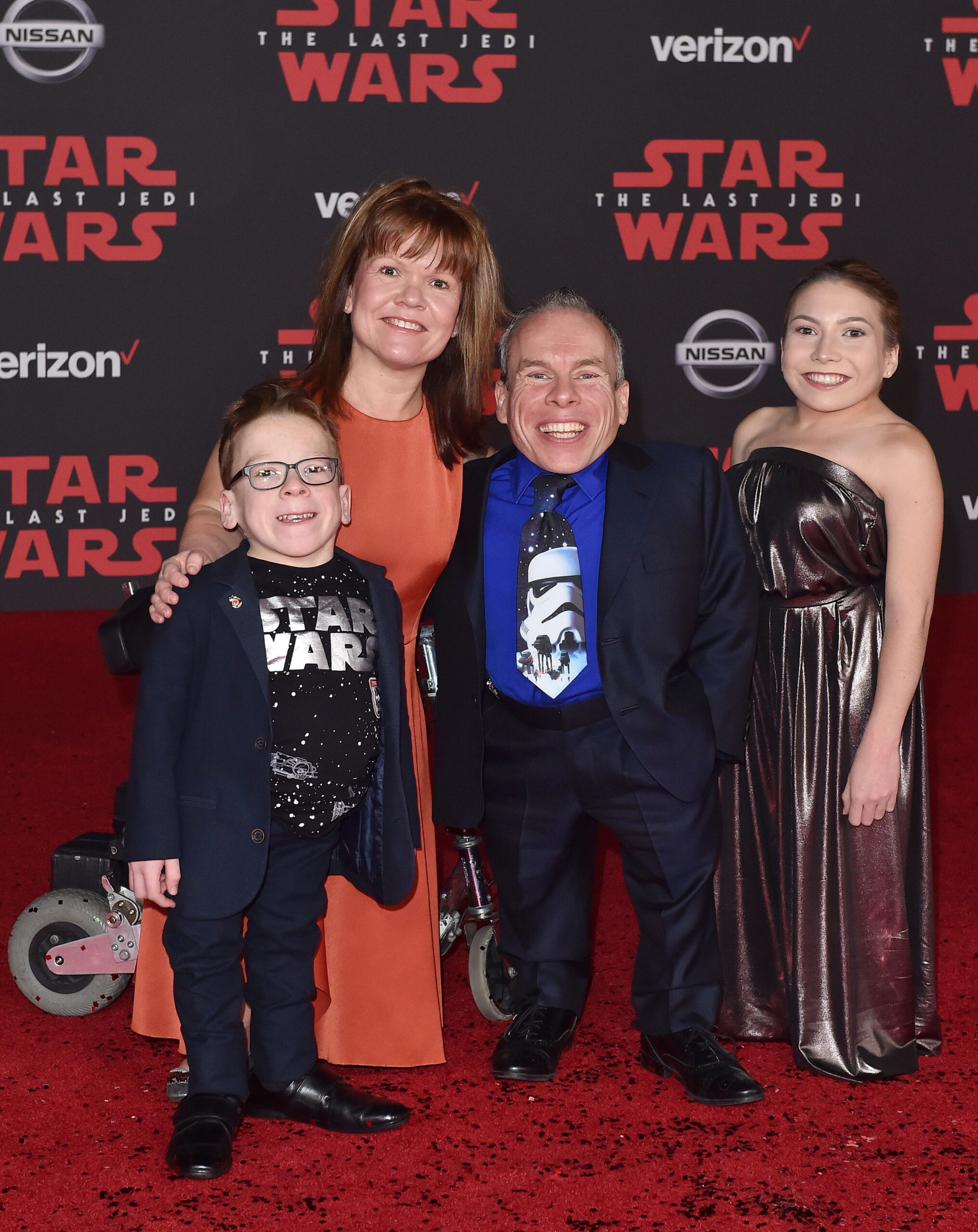 Warwick Davis and wife Samantha with their two children