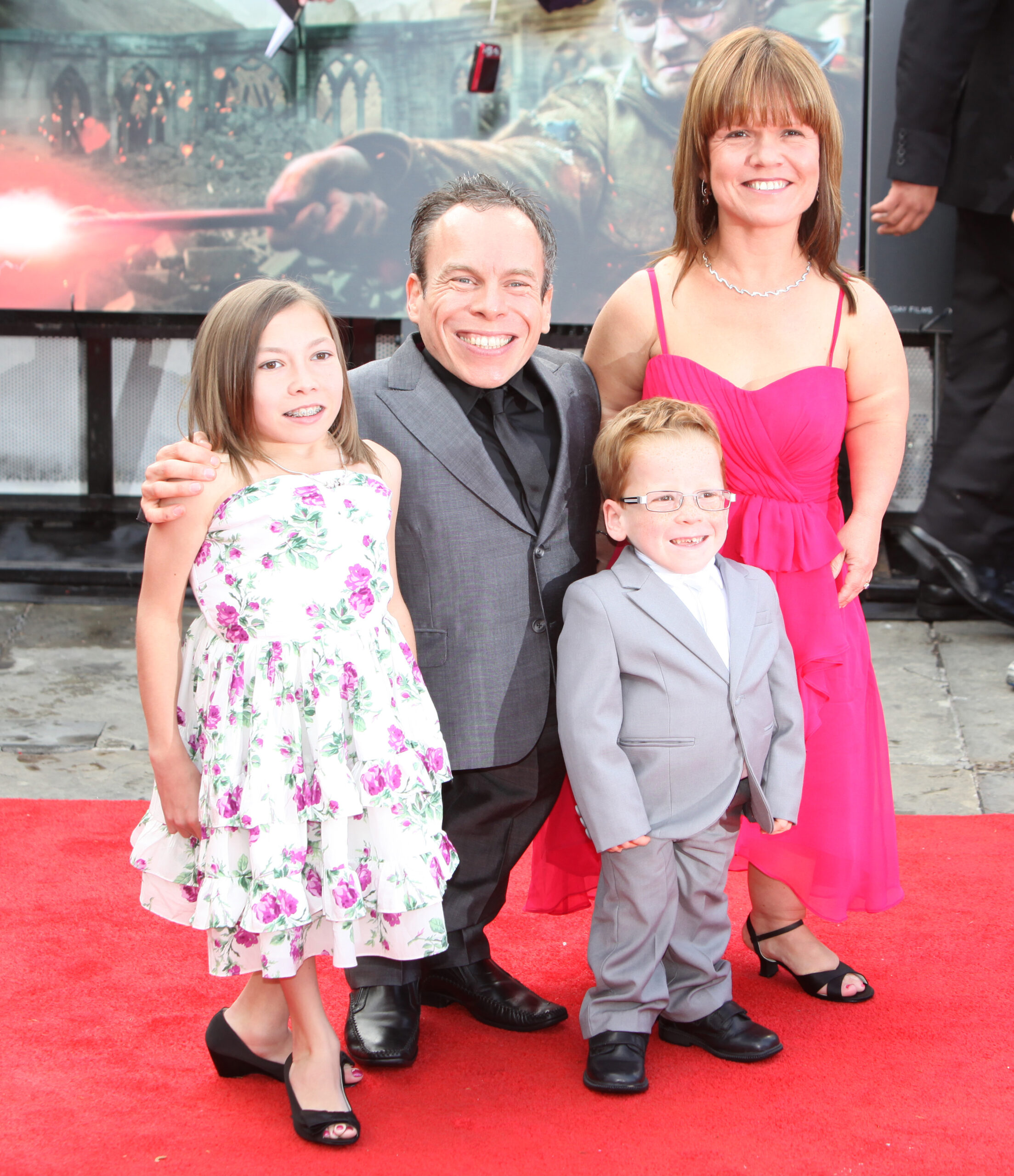 Warwick Davis and wife Samantha with their two children