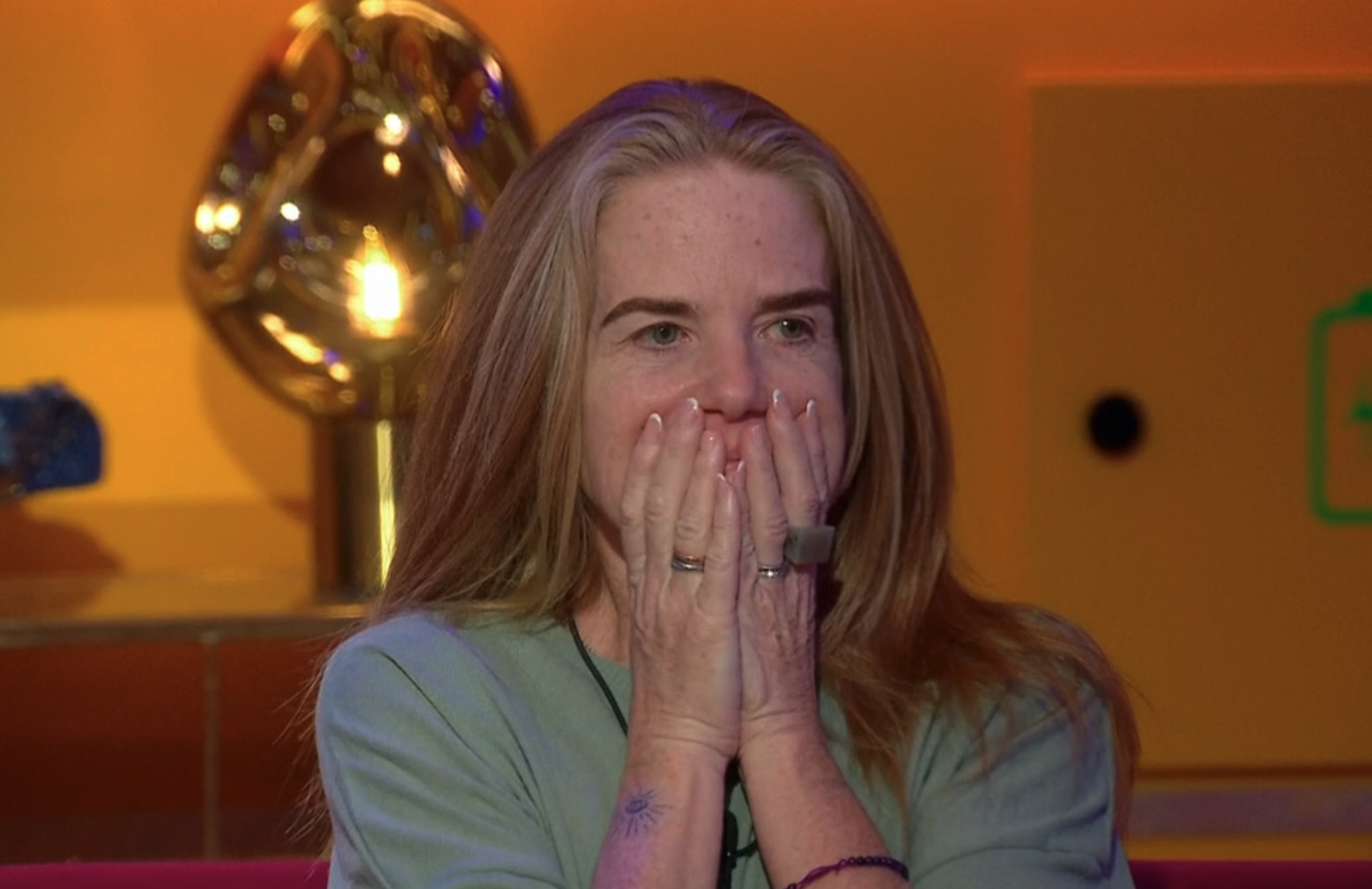 Patsy Palmer with her hands to her mouth