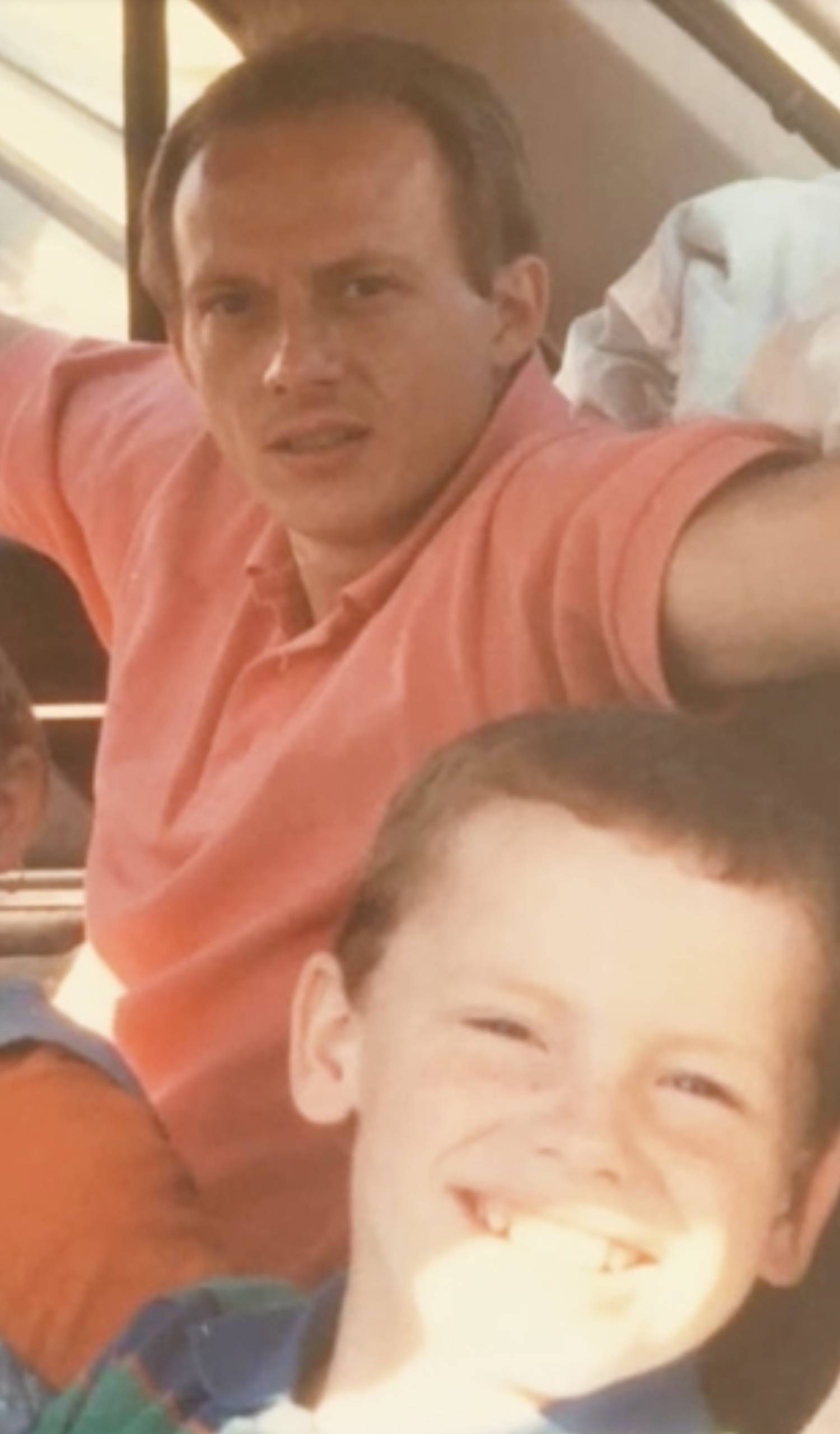 A young Joe Swash smiles with his dad