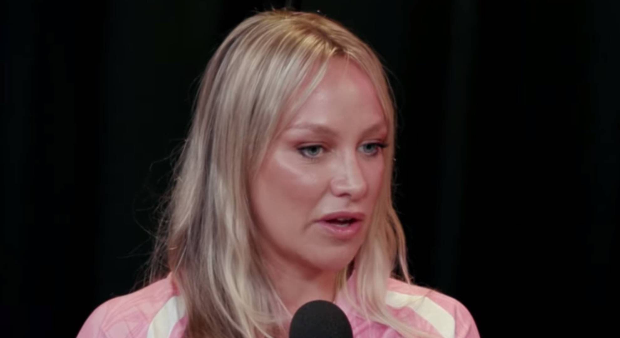 Chloe Madeley speaks into a mic