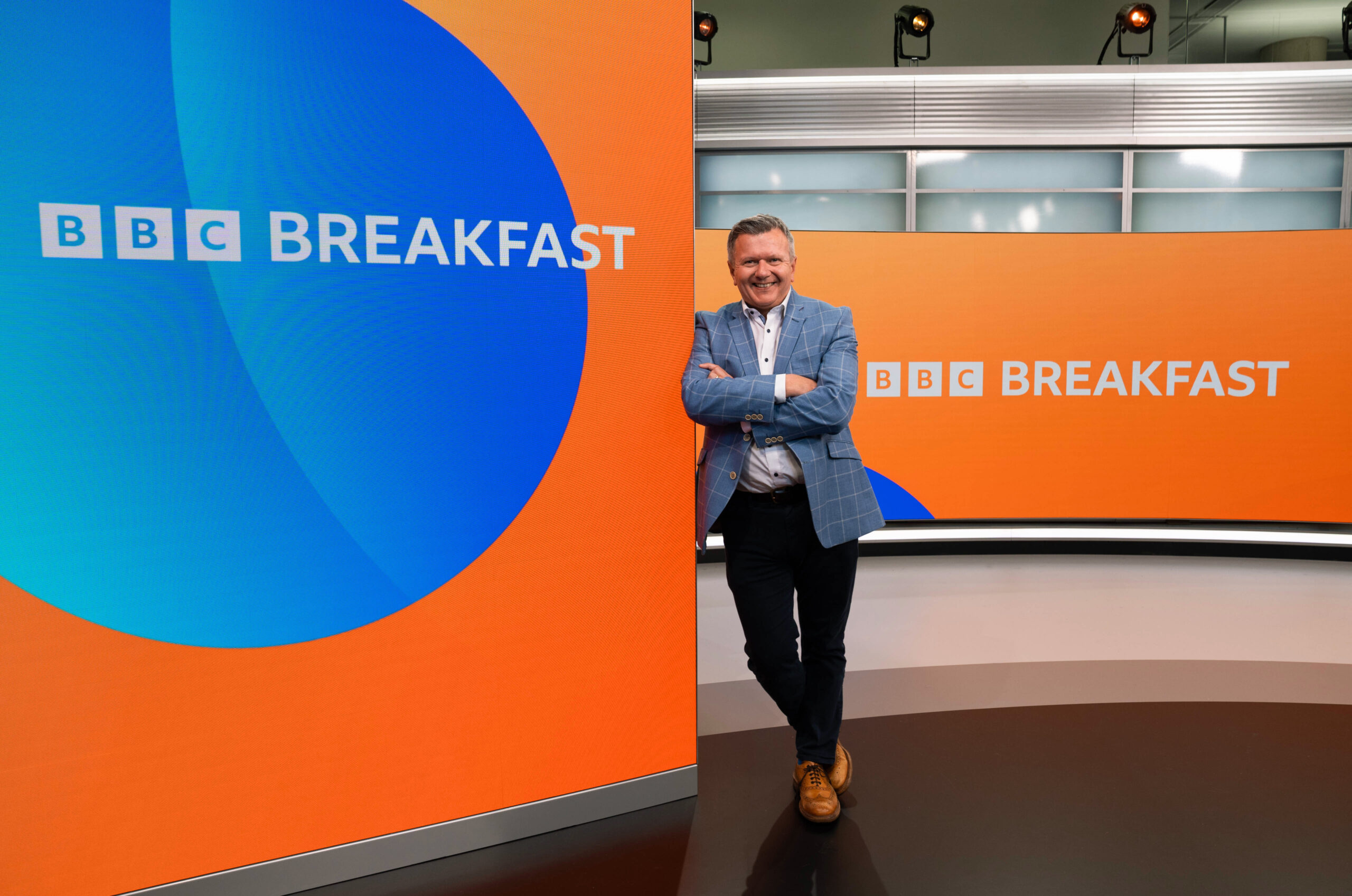 Richard Frediani smiling on the BBC Breakfast set 