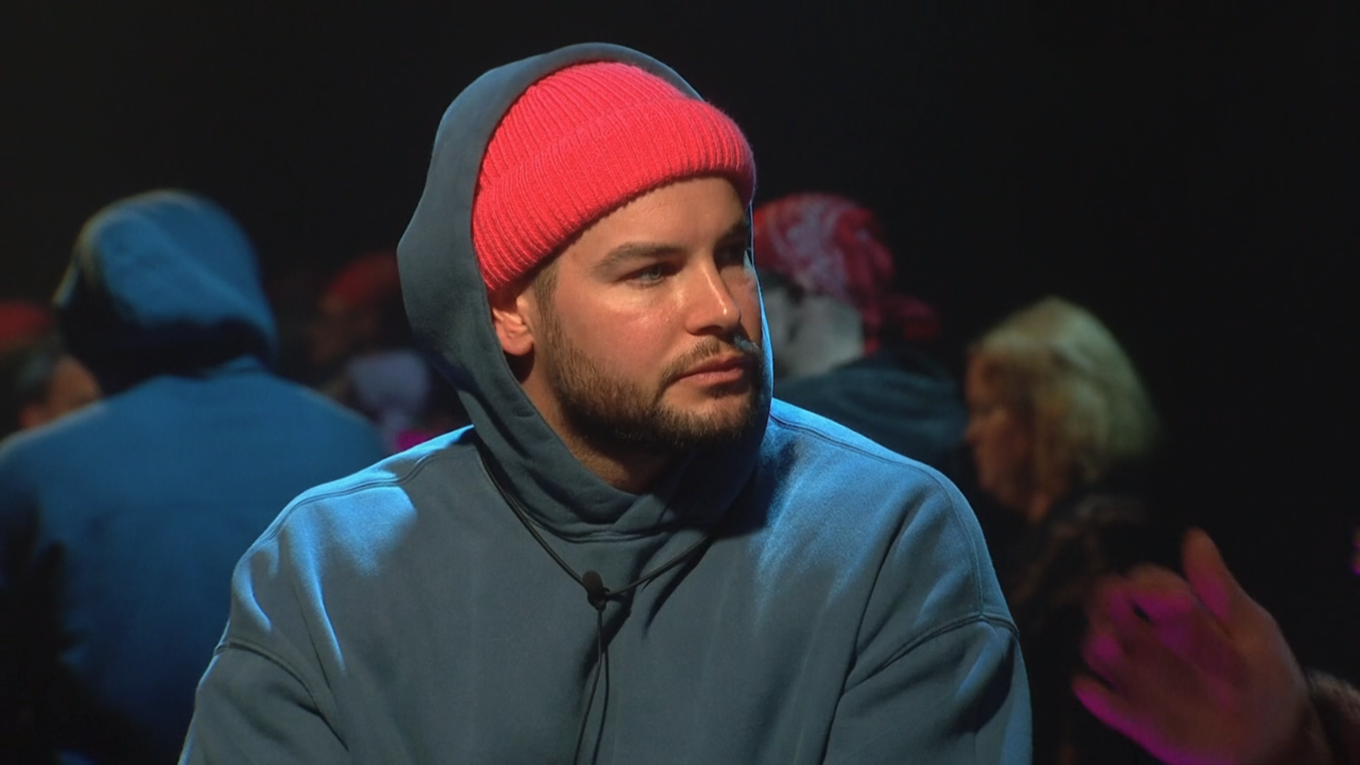 Chris Hughes in a red hat and hoody on CBB