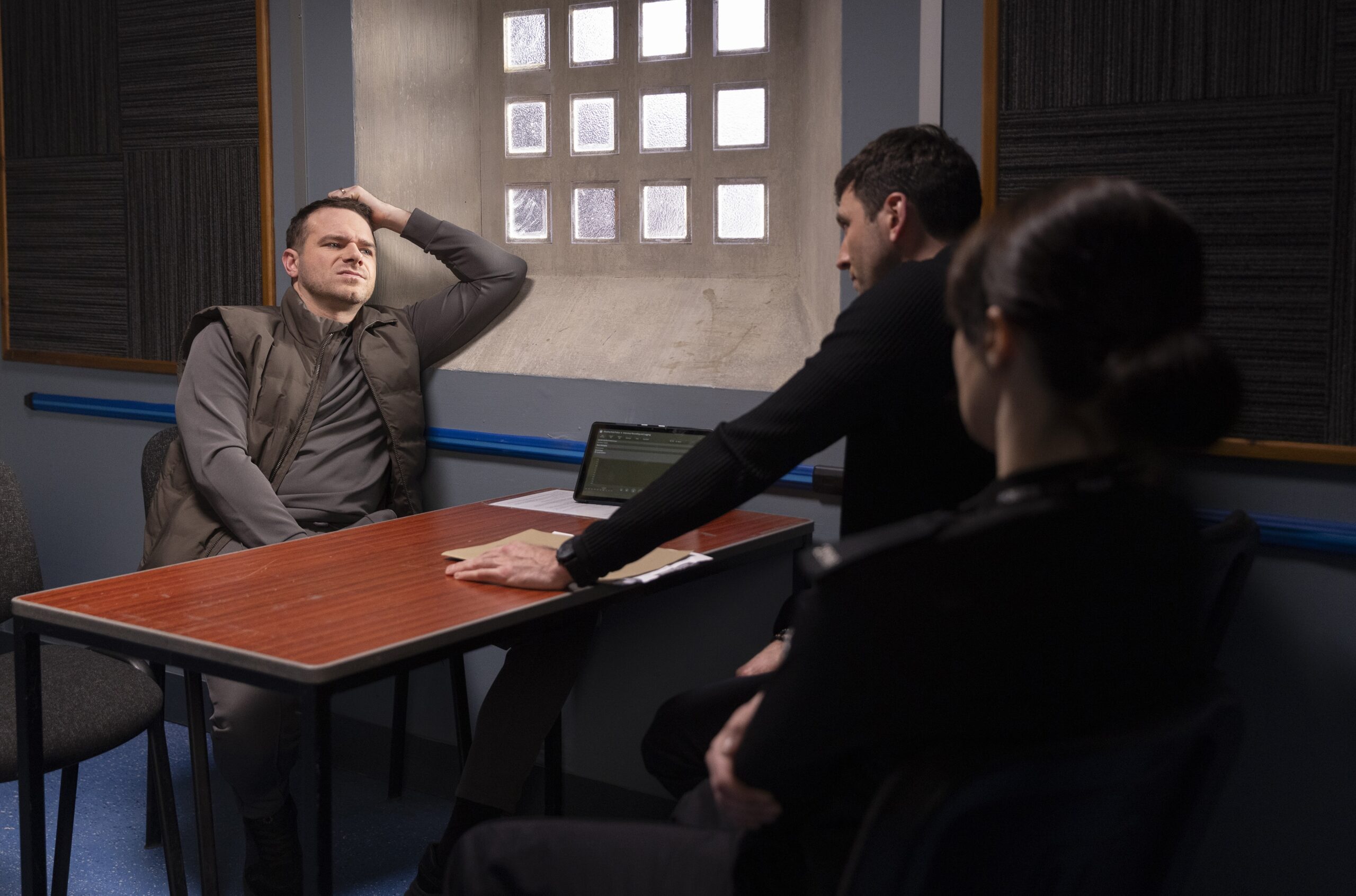 Mick questioned by Kit at the station in Corrie