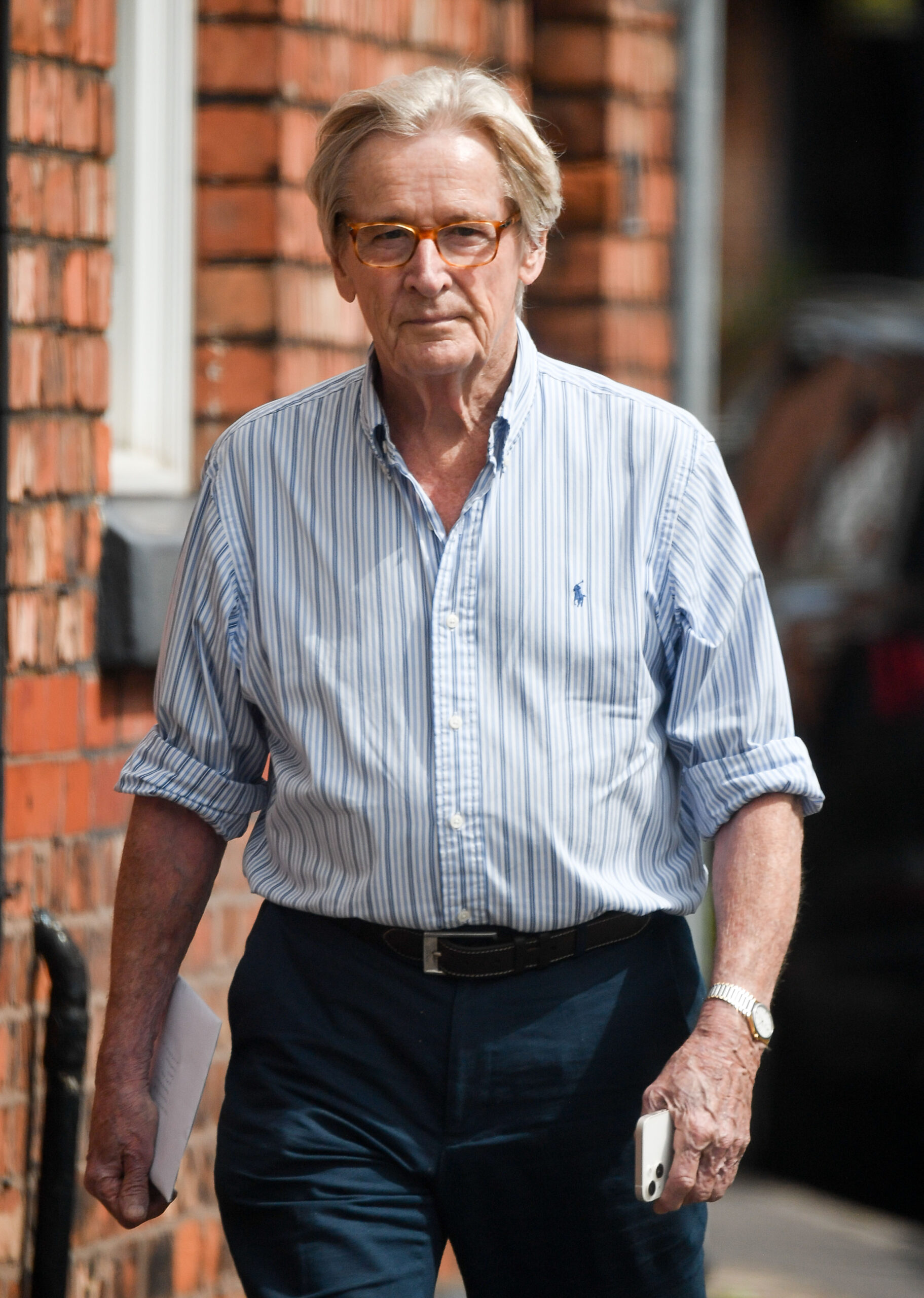 Bill Roache walking down the street