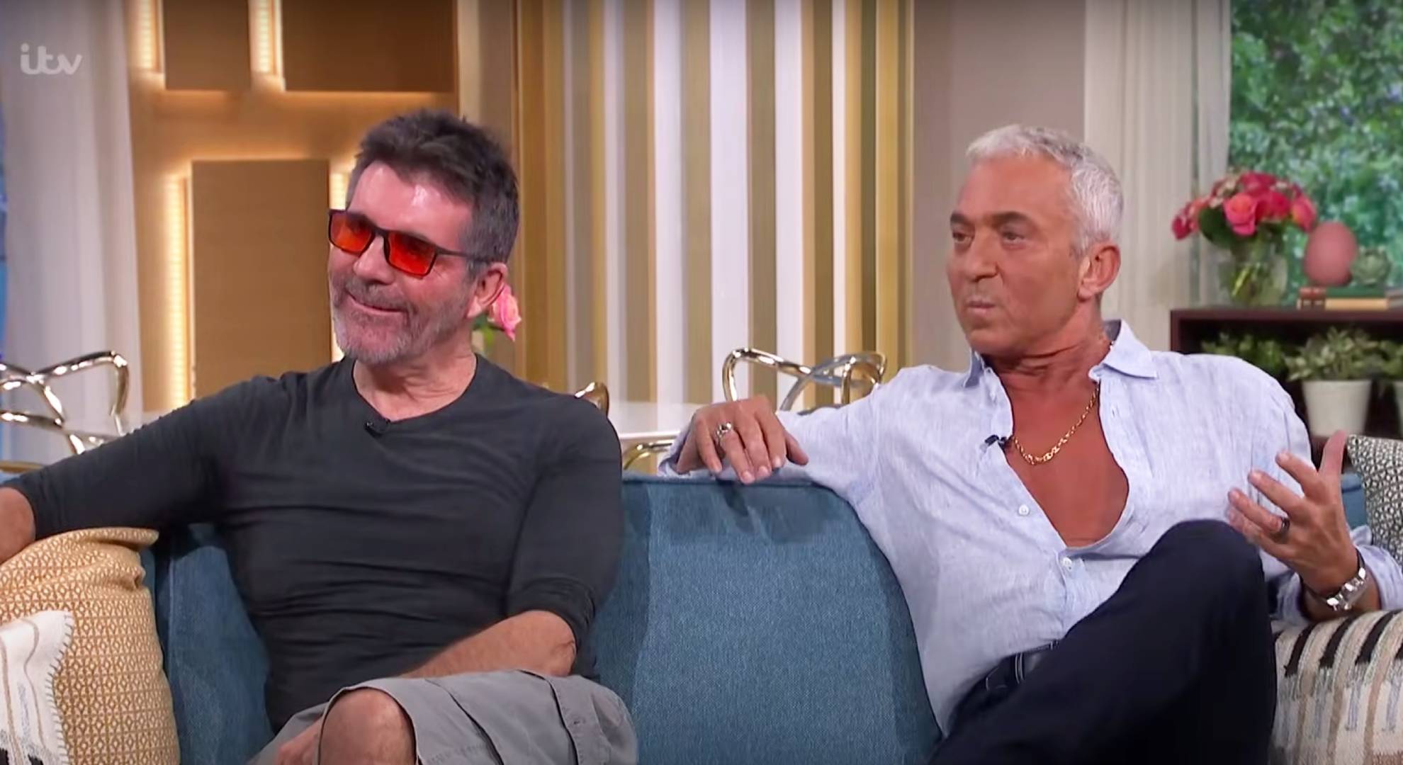 Simon Cowell listens, Bruno Tonioli lounges back on the sofa