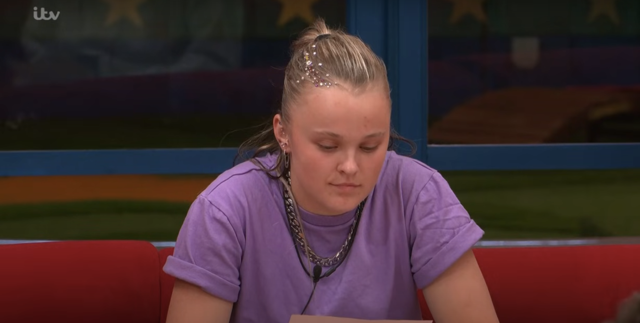 JoJo Siwa reading her letter from home