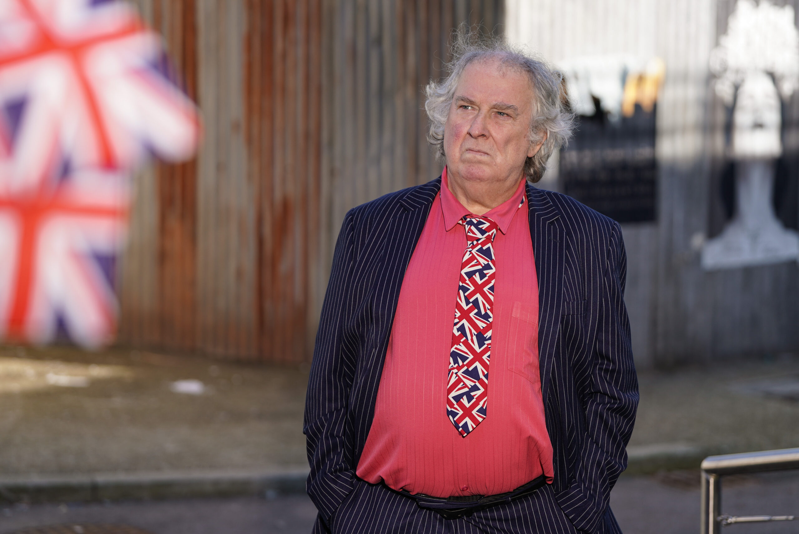 Nigel looking thoughtful in his red shirt and Union Jack tie