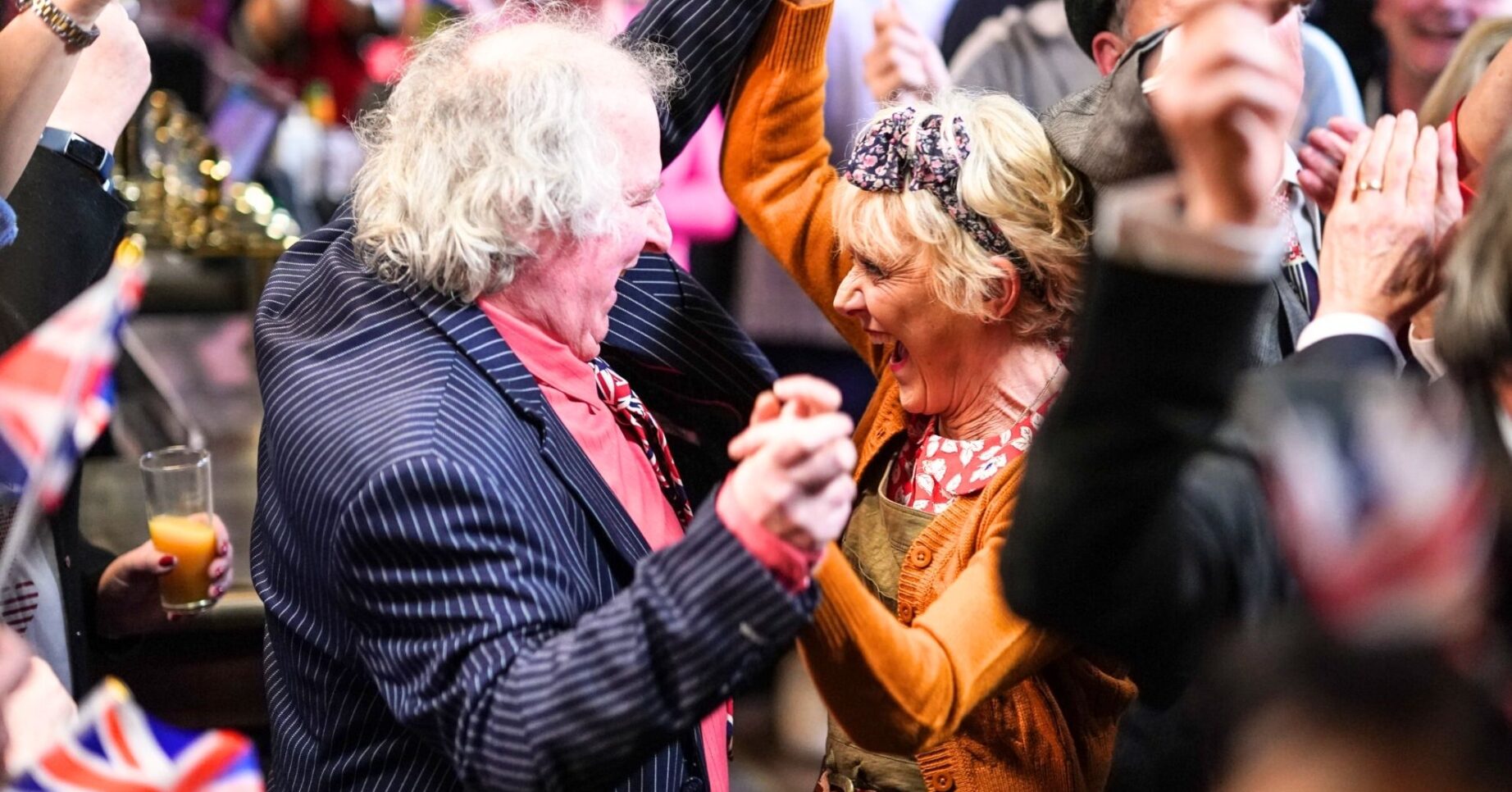 Nigel and Jean dance at a packed V.E. Day party (Credit: BBC)