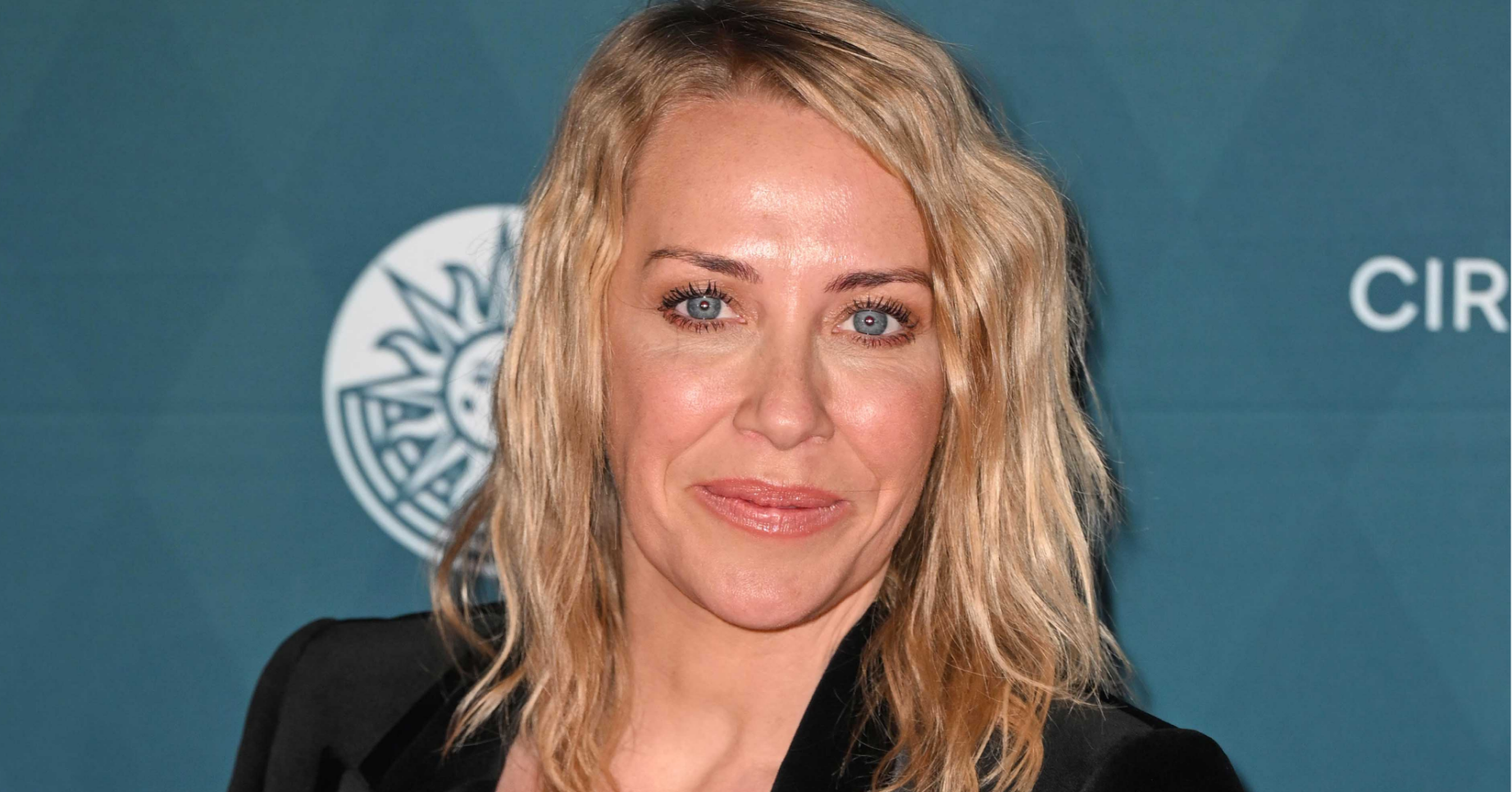 Laura Hamilton smiling on the red carpet