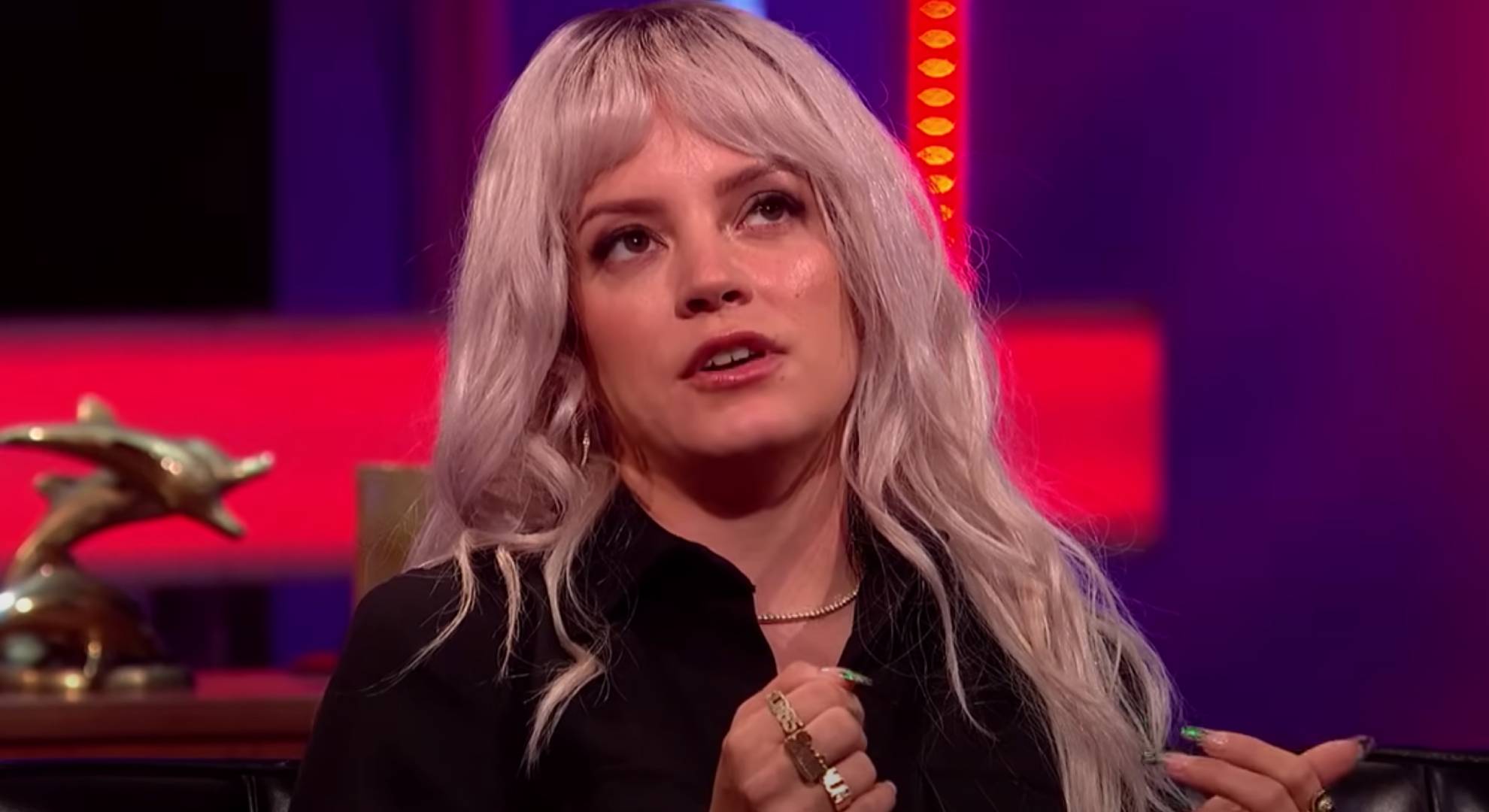 Lily Allen looks upwards