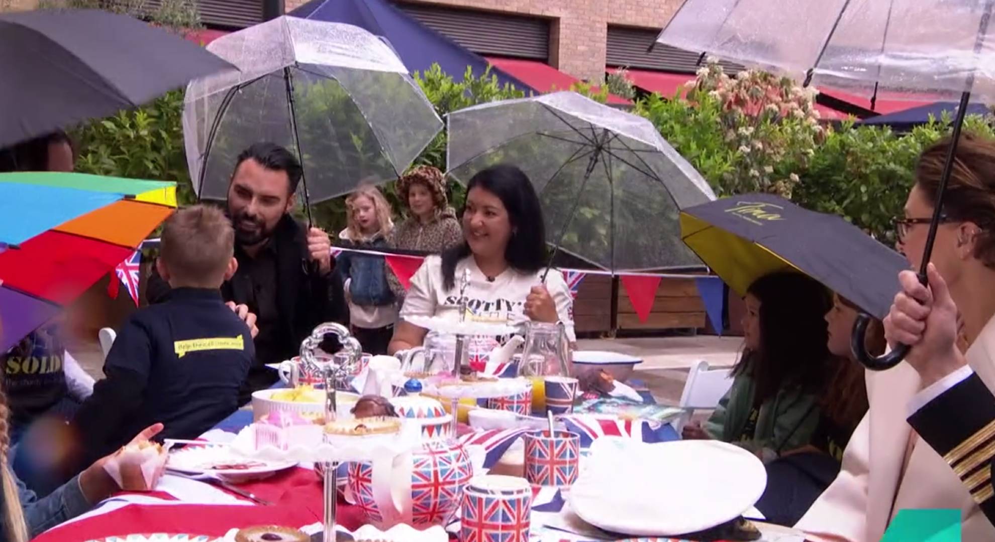 Rylan holding an umbrella