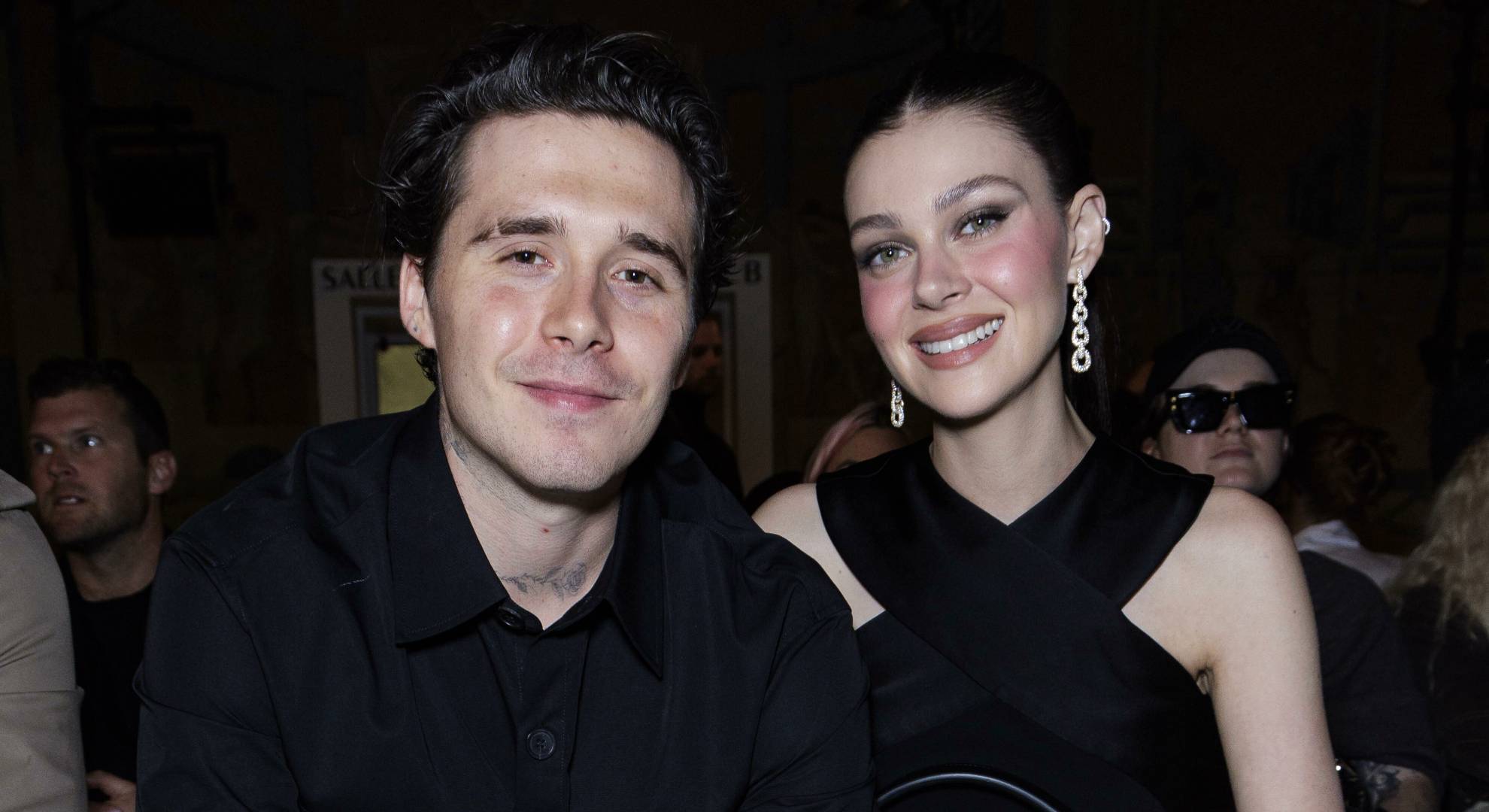 Brooklyn Beckham and Nicola Peltz smile