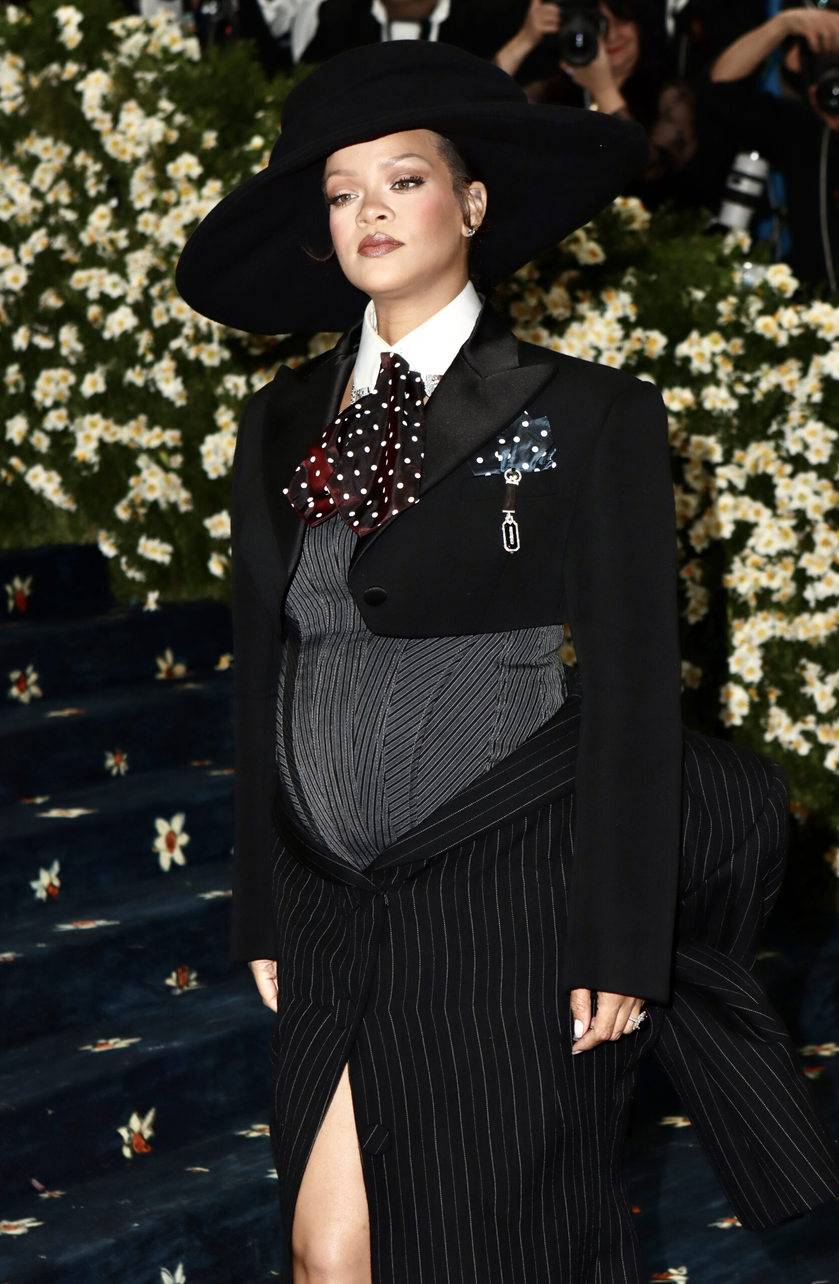 Rihanna debuts baby bump at Met Gala