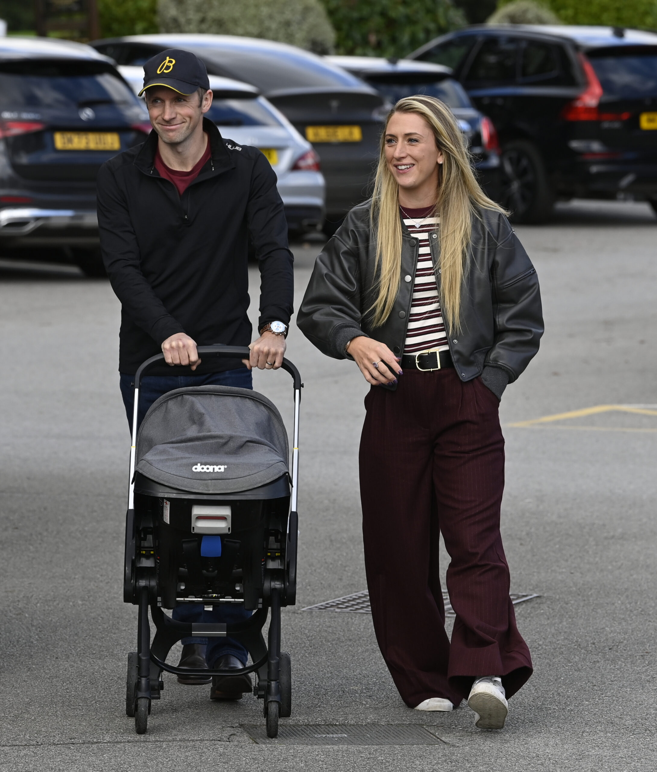Laura and Jason Kenny walking their baby