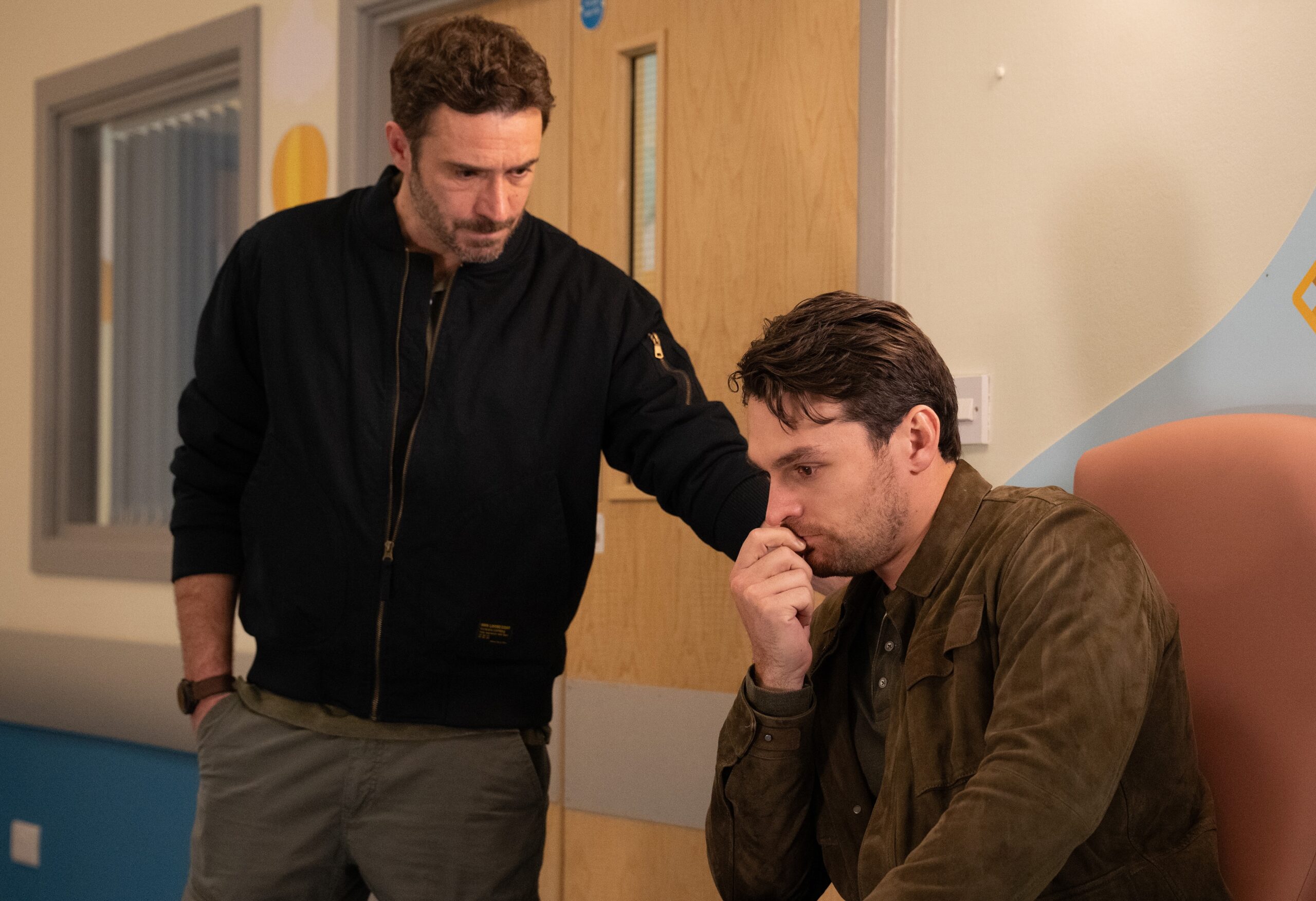 Emmerdale's John comforting Mack at the hospital