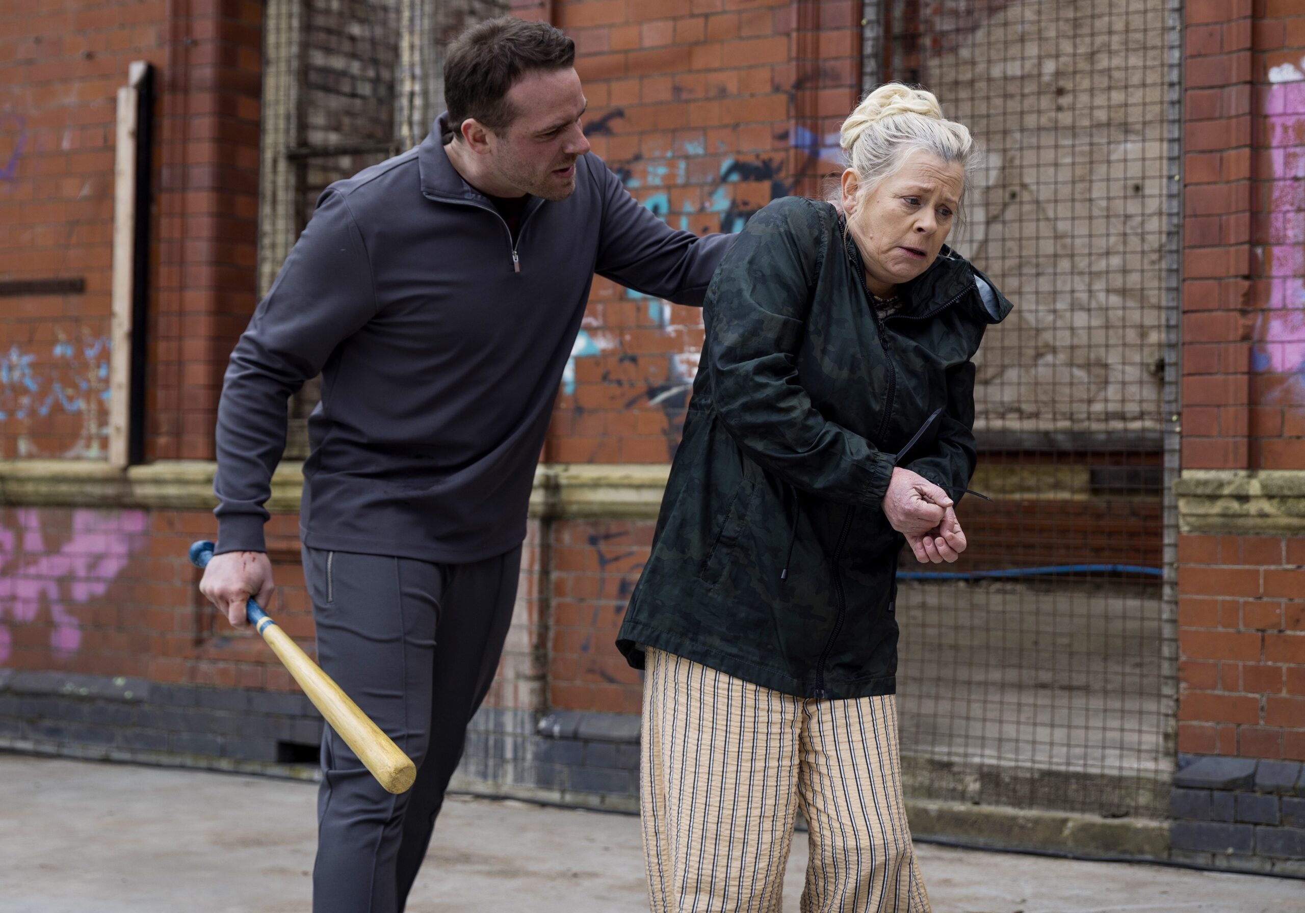 Mick holding onto Bernie angrily in Coronation Street