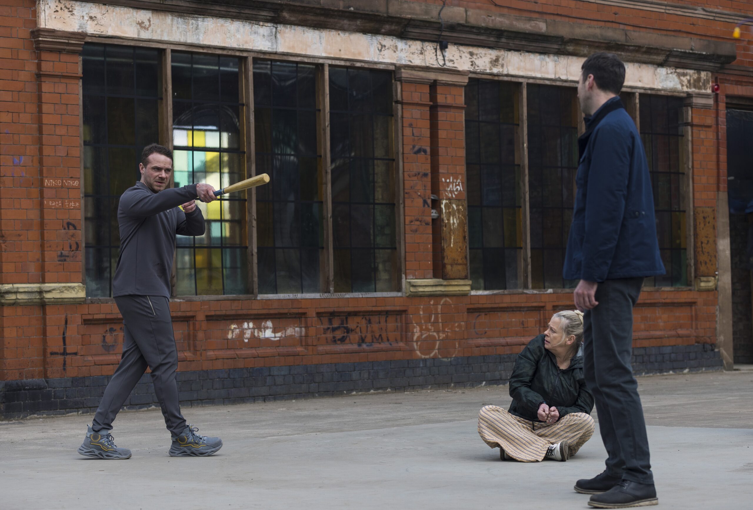 Mick threatens Bernie and Kit with a baseball bat on Corrie