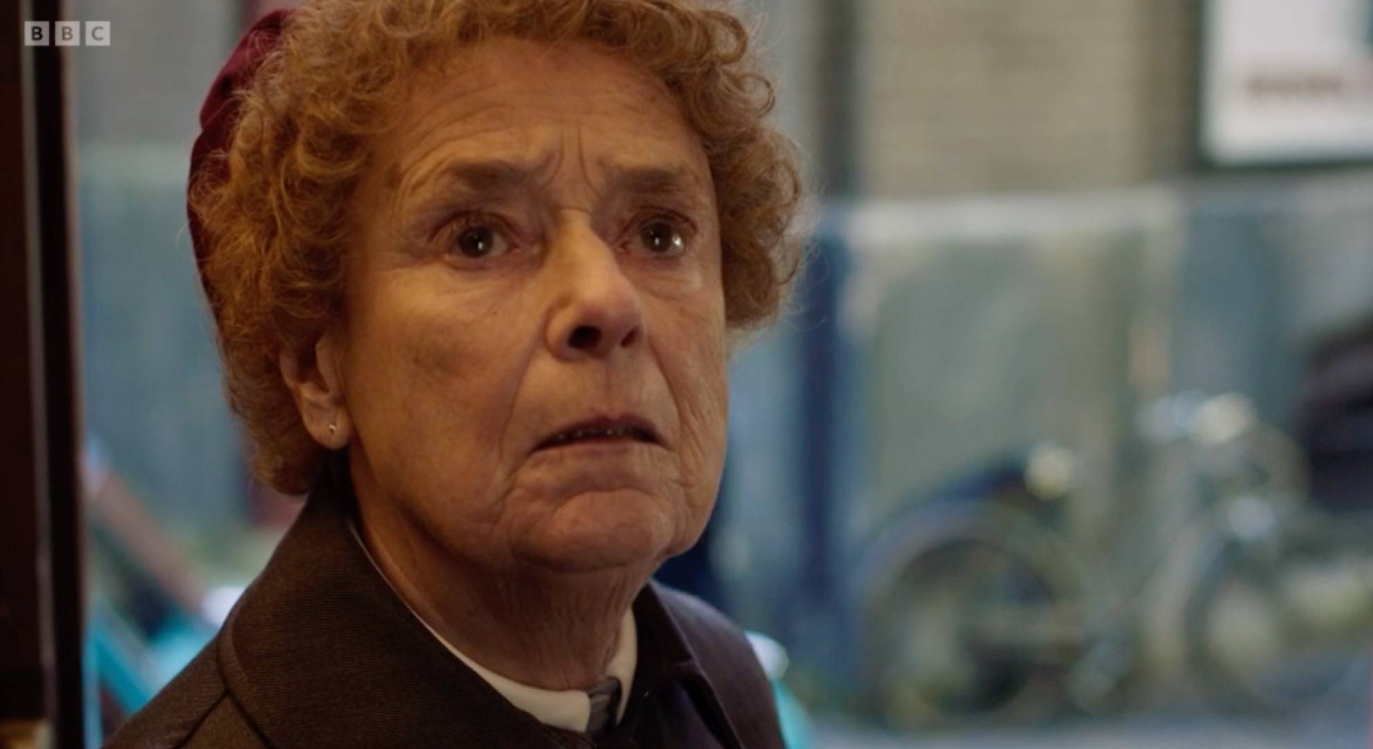 Linda Bassett looks up while performing in character