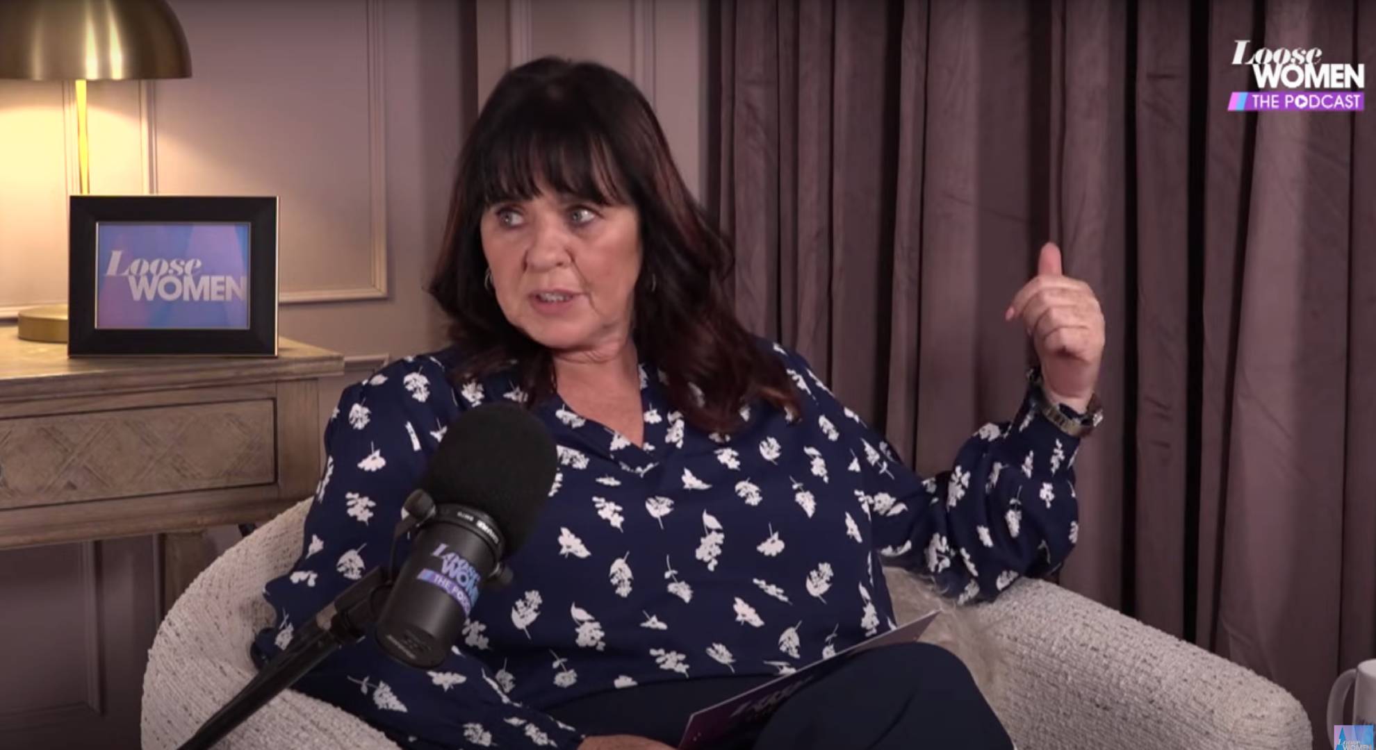 Coleen Nolan indicates with her thumb