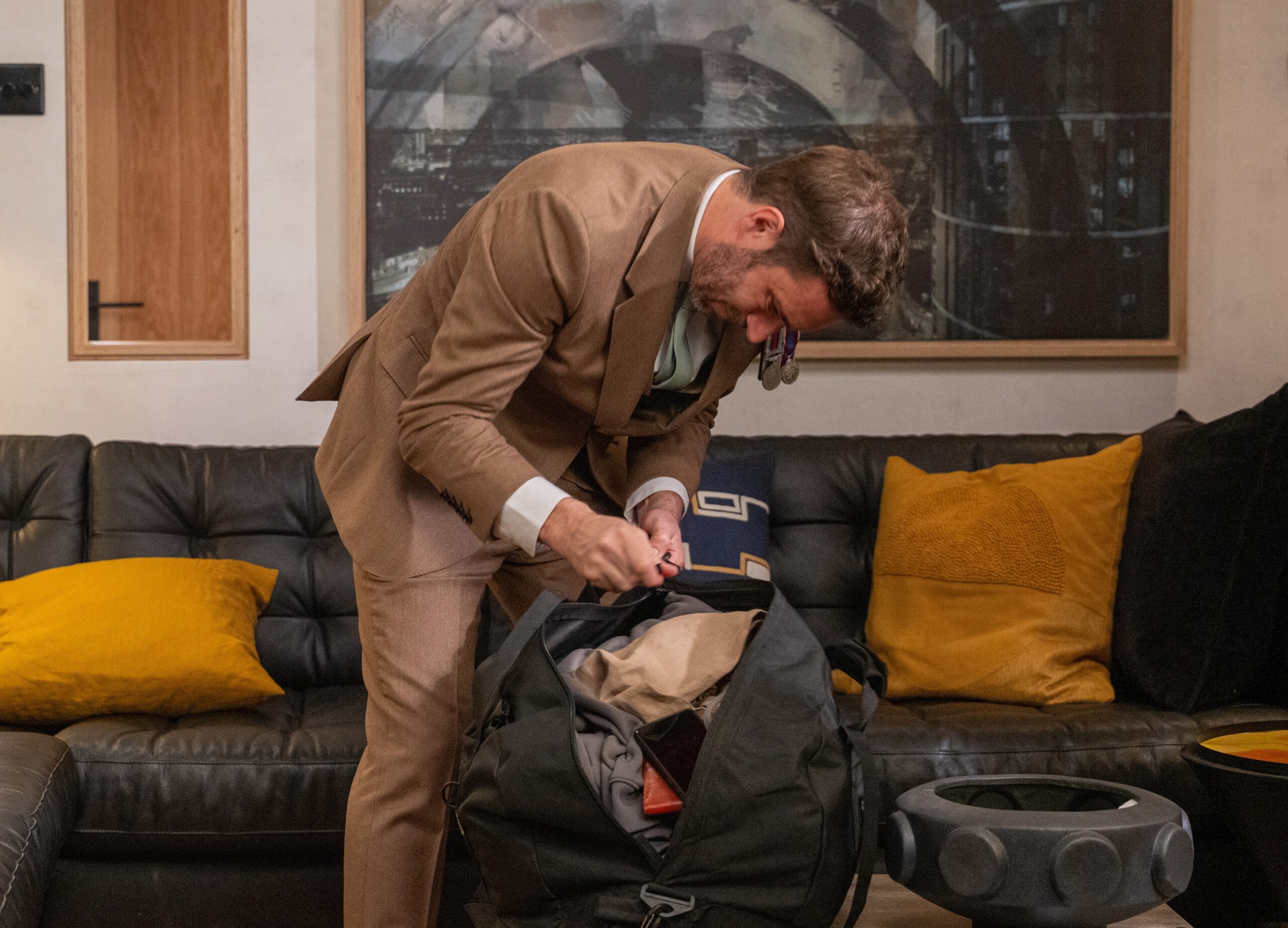 John packing a bag in Emmerdale