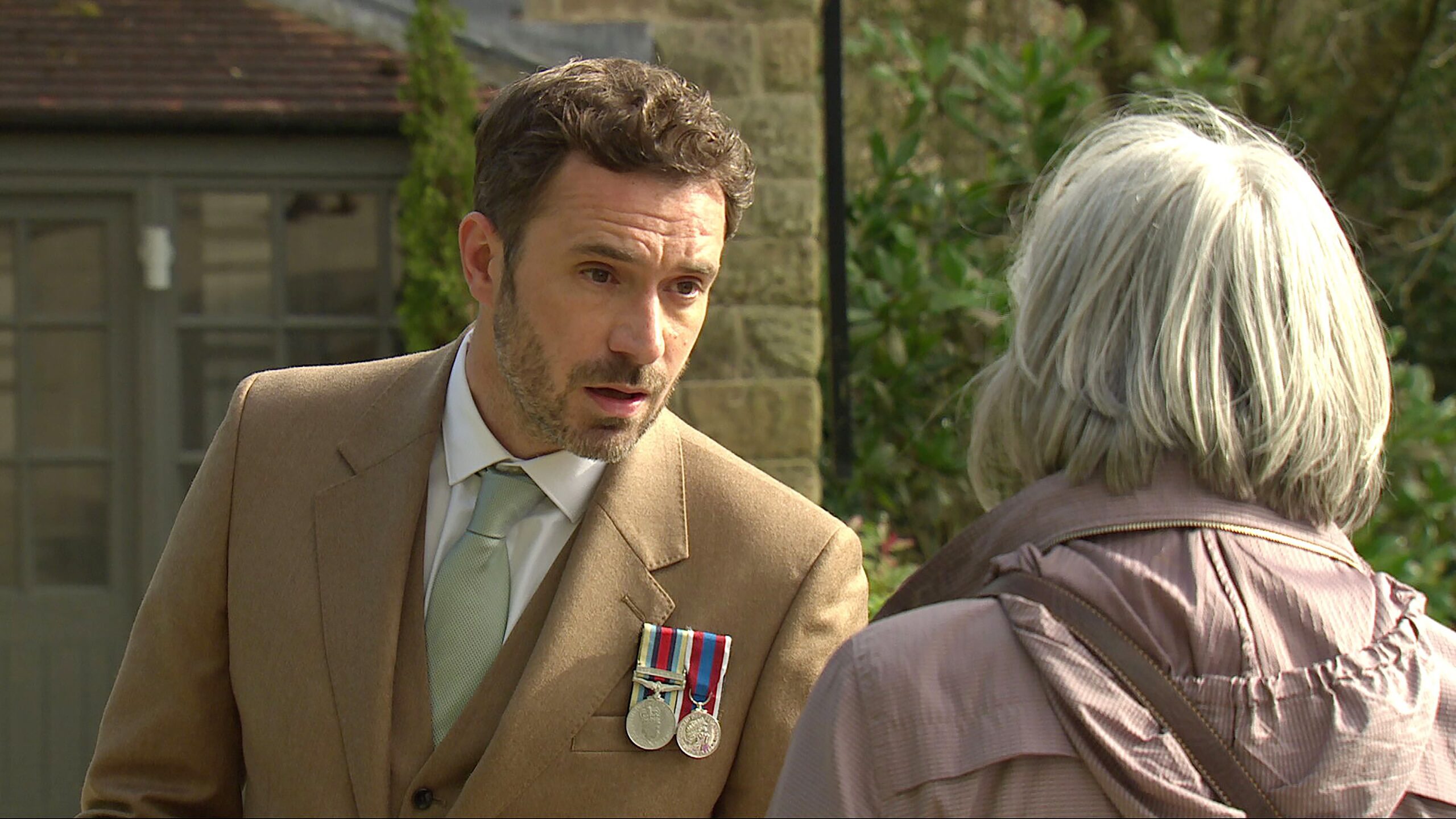 John talking to Cathleen outside