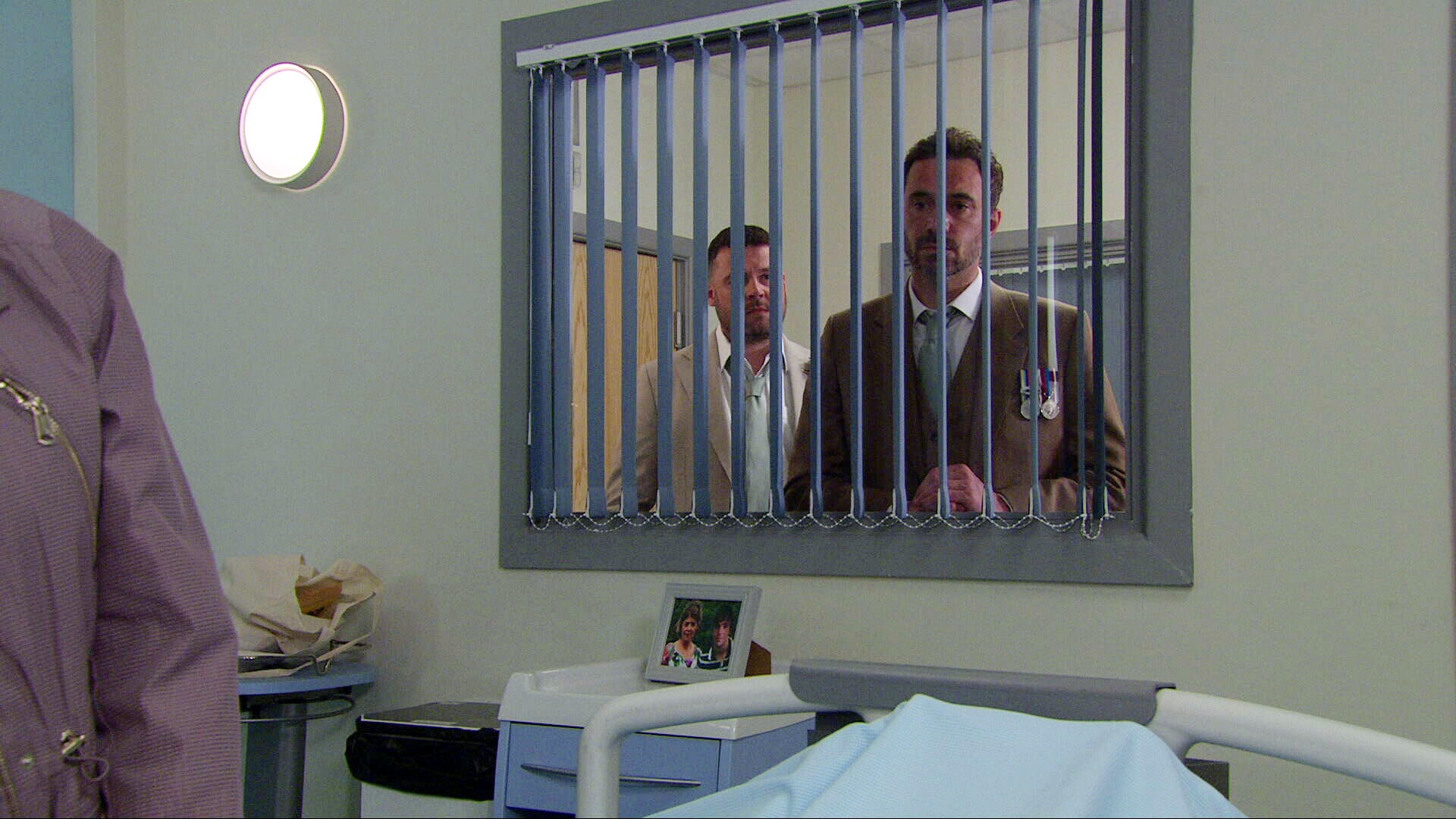 John and Aaron looking through hospital window