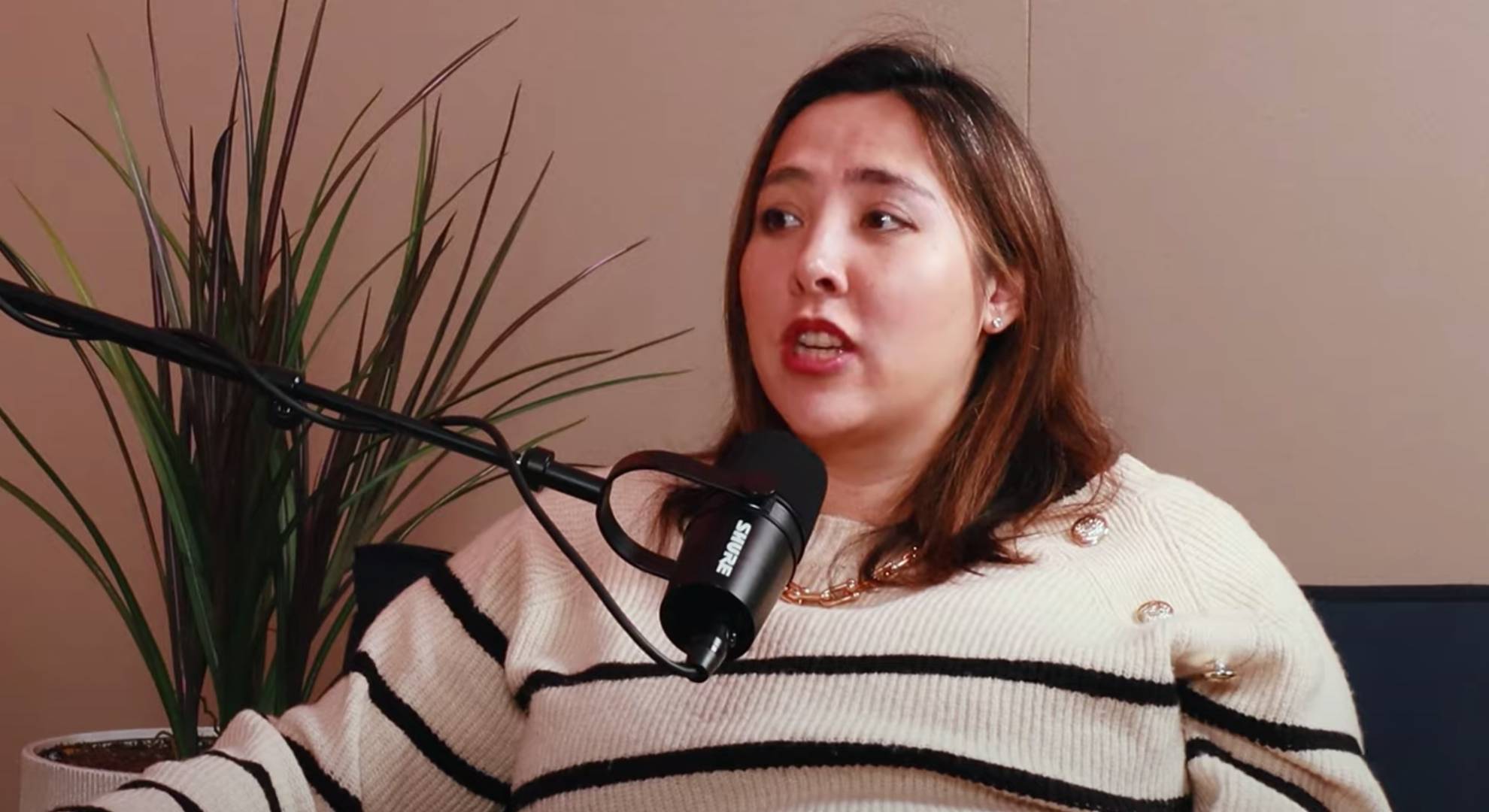 Michelle Elman speaks into a microphone