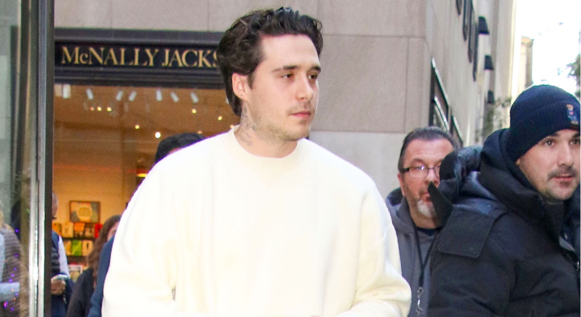 Brooklyn Beckham looking to the side 