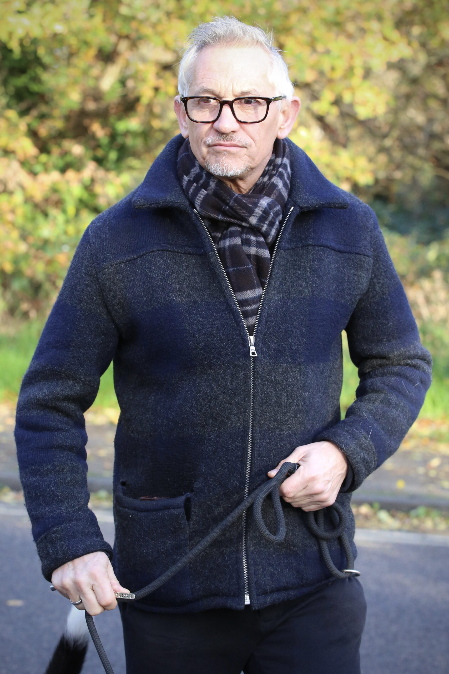 Gary Lineker walking his dog