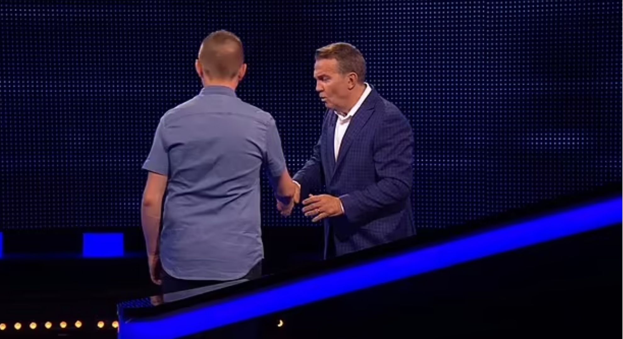 Neil shaking Bradley Walsh's hand