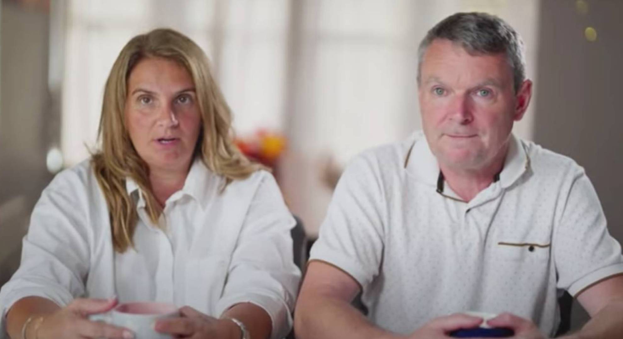 Sue Radford and Noel Radford sit together