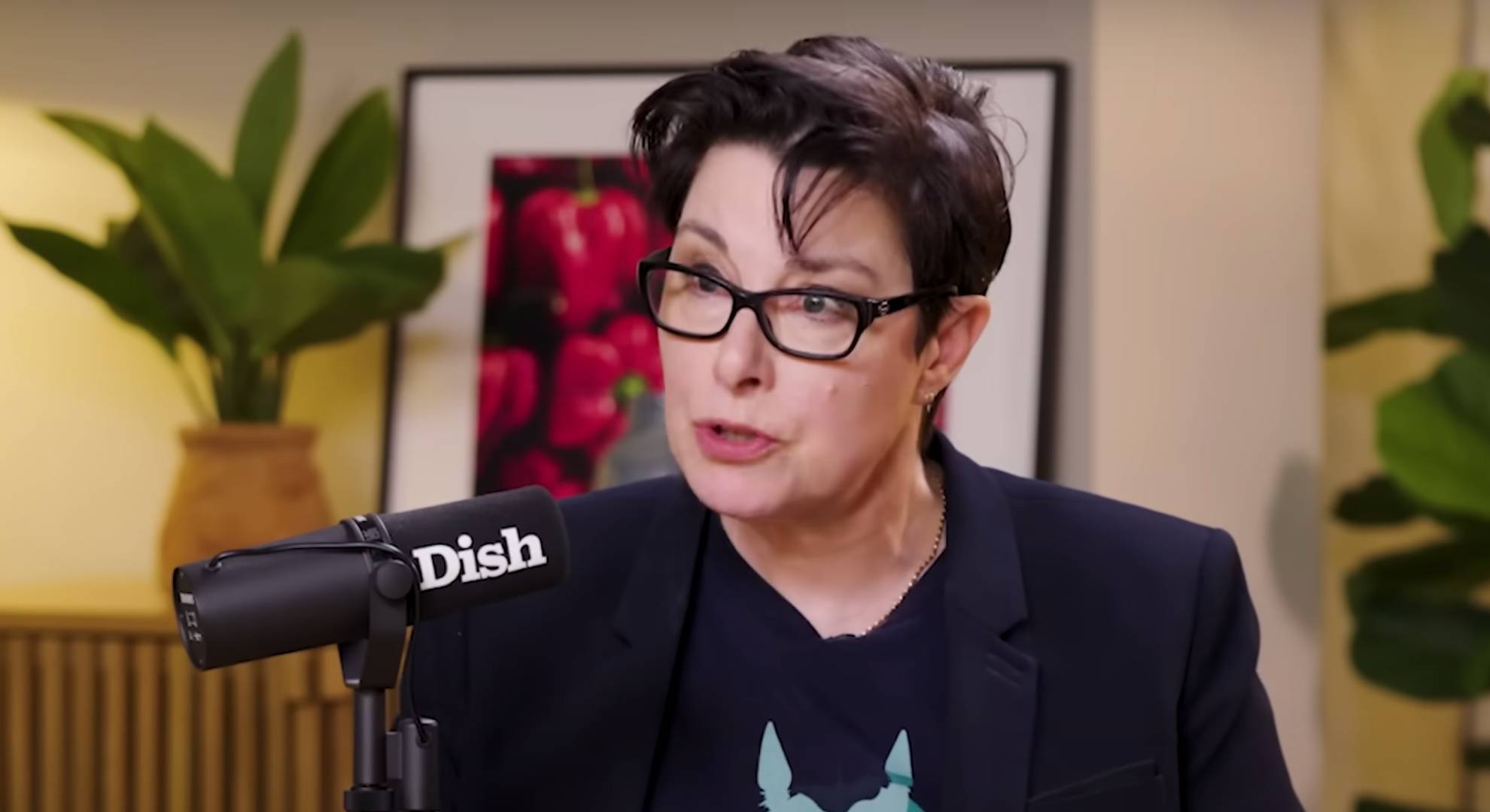 Sue Perkins speaks into a microphone