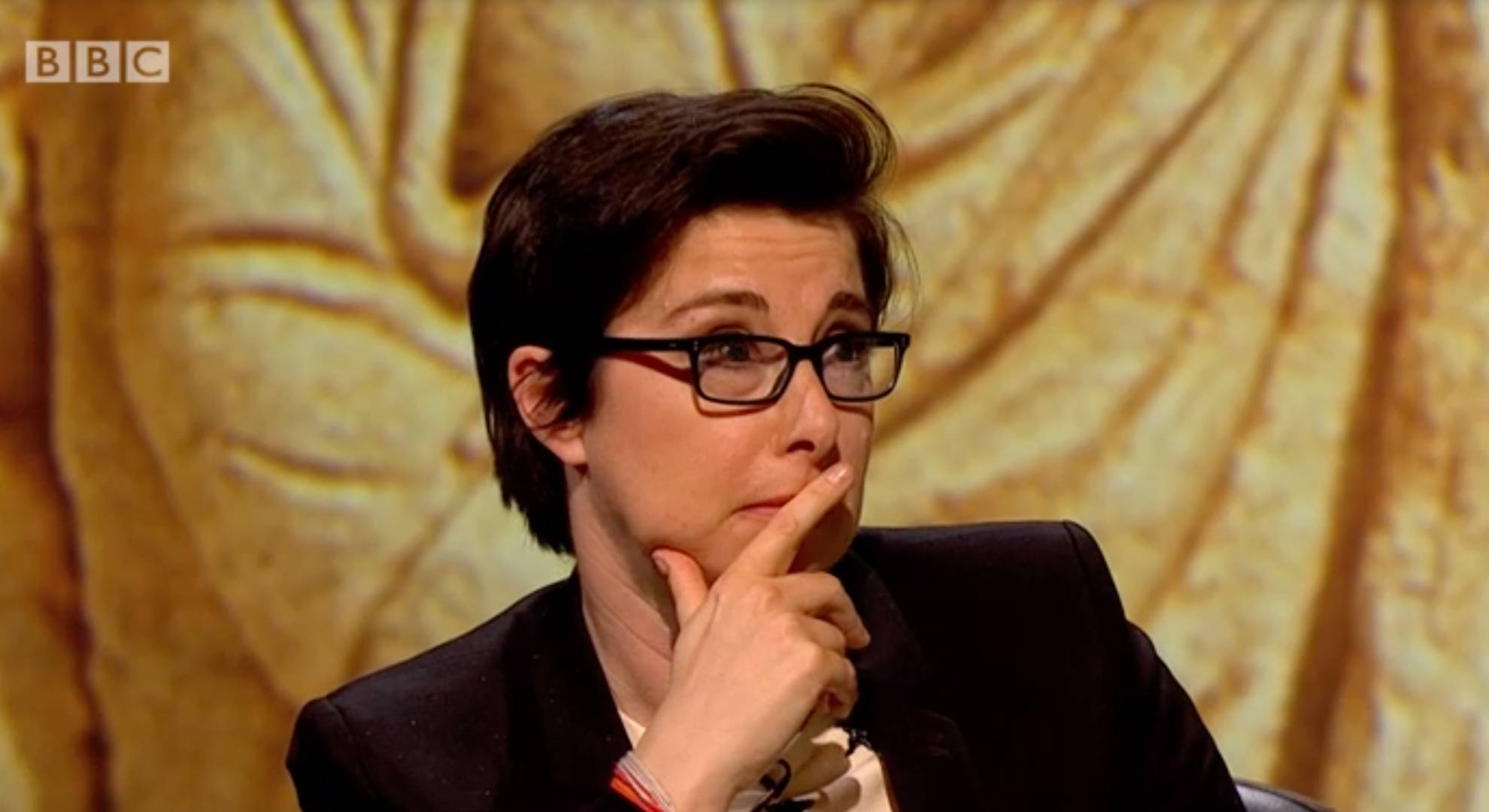 Sue Perkins places a finger over her lips