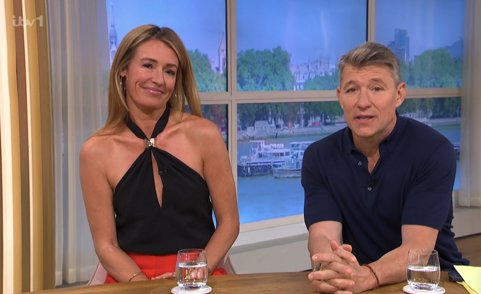 Cat Deeley presenting This Morning in a black halterneck top alongside Ben Shephard