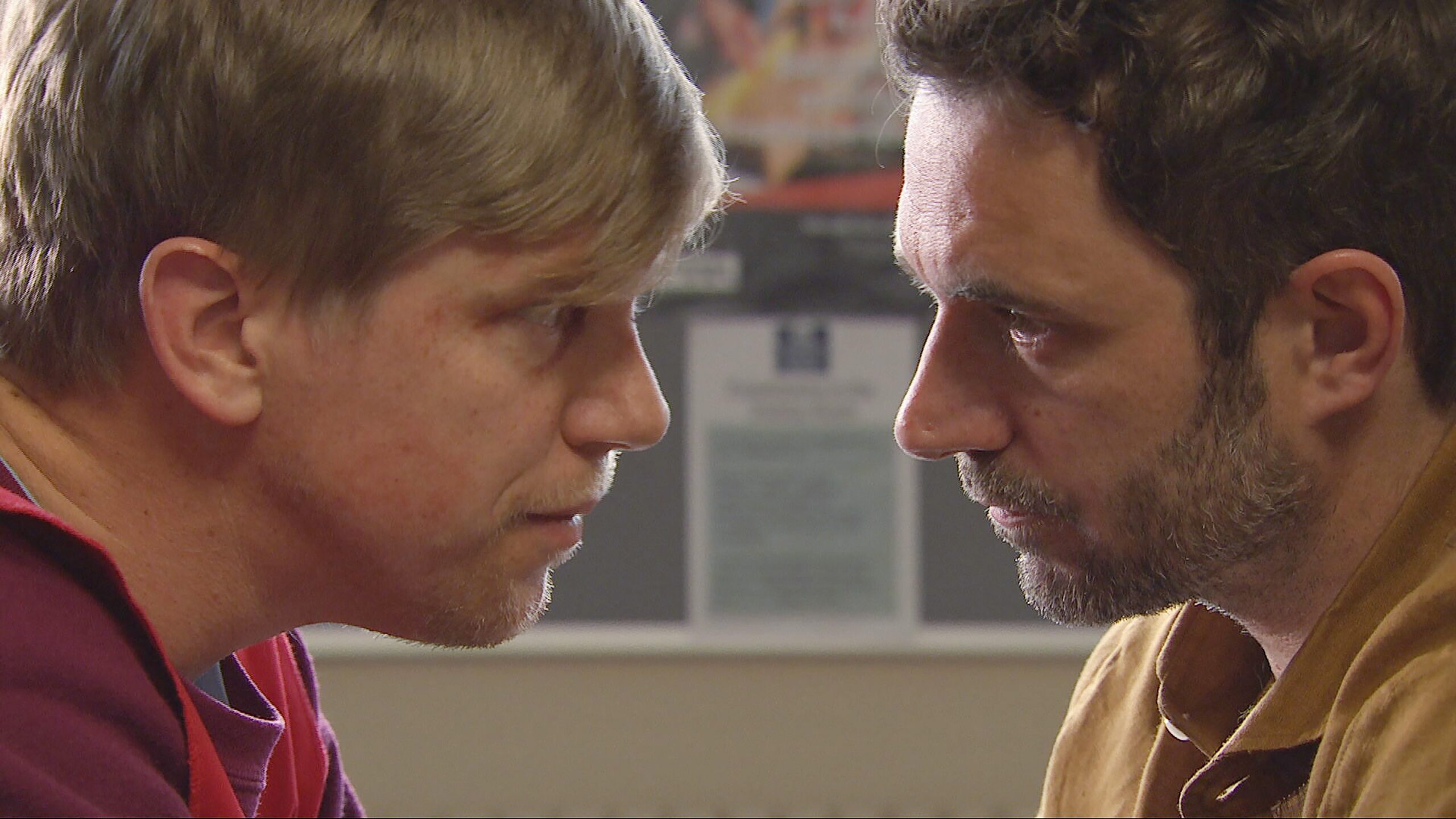 Robert and John staring at each other