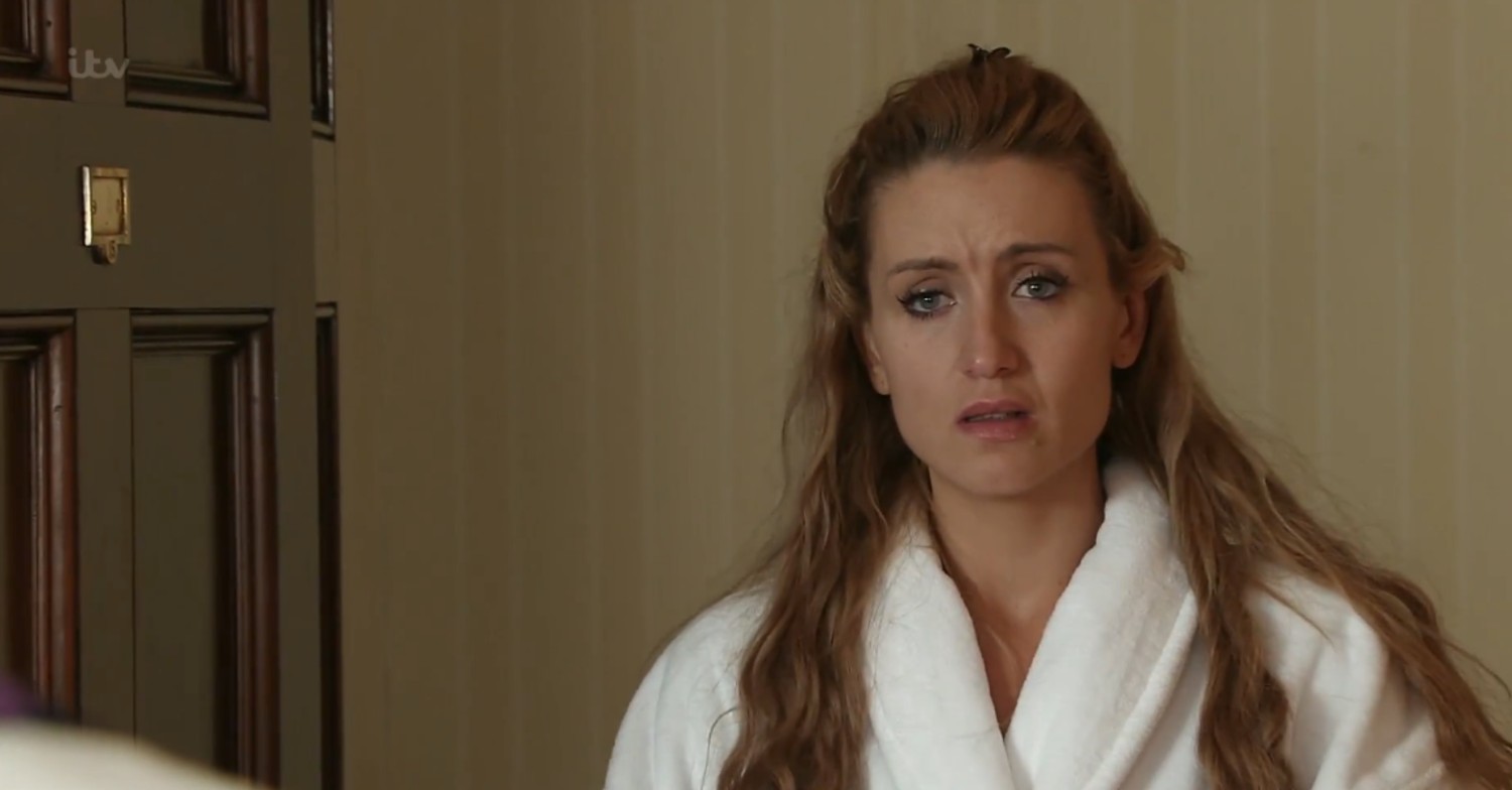 Eva looks upset on Coronation Street